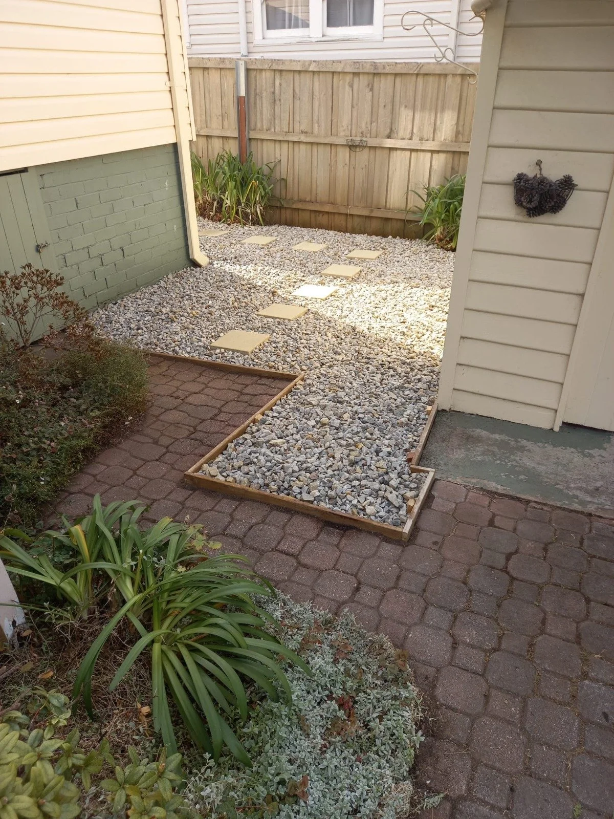 Cleaned up transition between old beds & existing paving