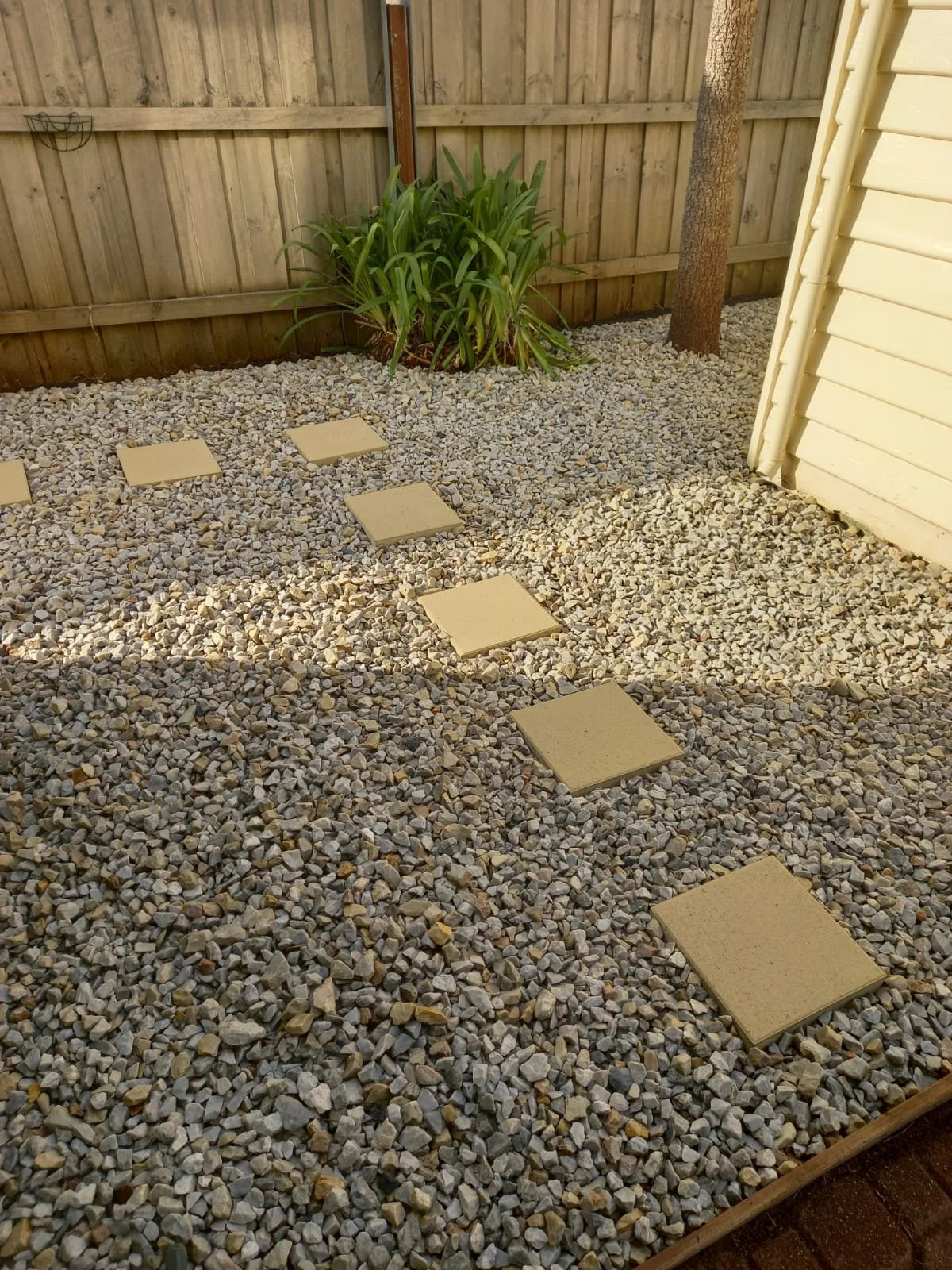 Functional pathways installed, weed mat and stones replaced overgrown beds
