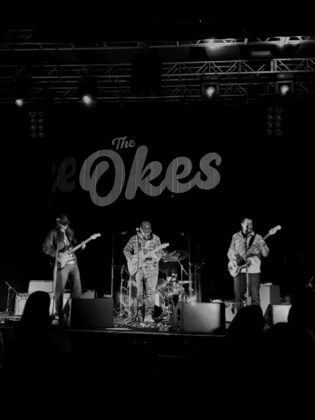 The Okes performing on stage