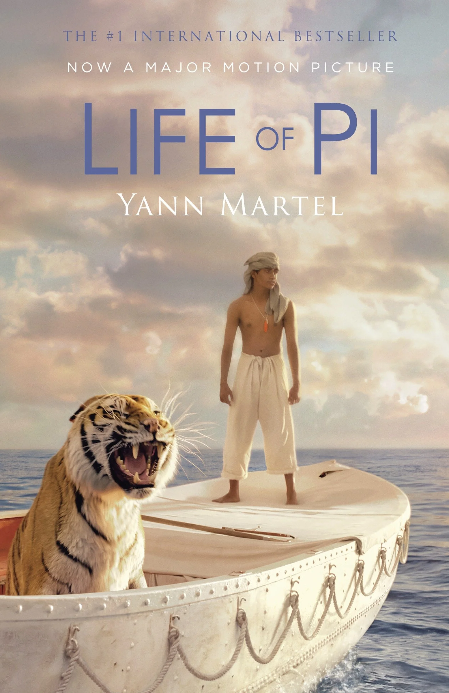 Cover of Life of Pi by Yann Martel, a novel about survival and faith, featuring a film still image of a boy and tiger on a lifeboat at sea