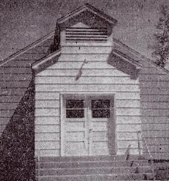 Historic black-and-white photo of the original Longville Bible Chapel building.