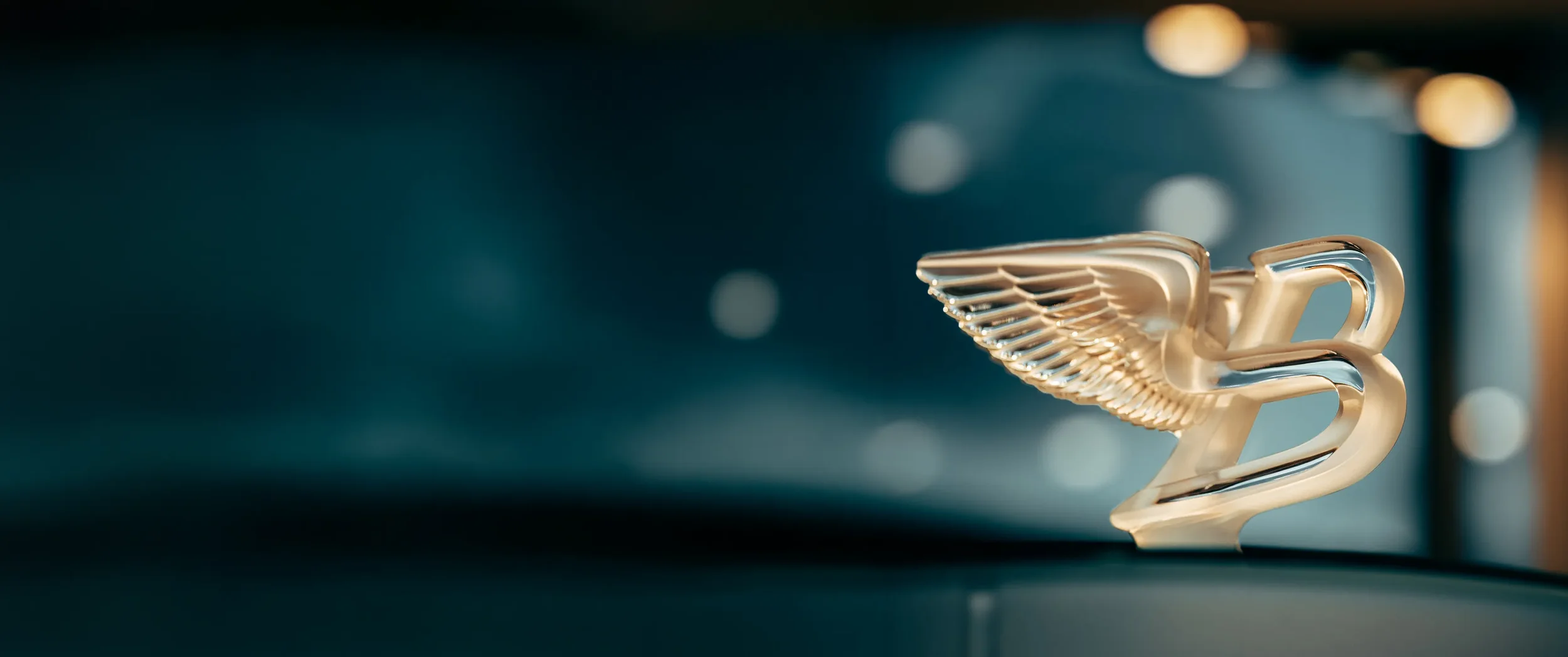 Bentley B logo representing the social media marketing strategy that scaled the global luxury community to 13 million followers