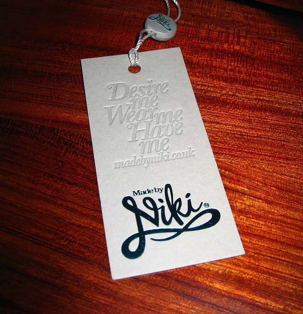 Branding and packaging design detail showing tactile finish and brand colour palette