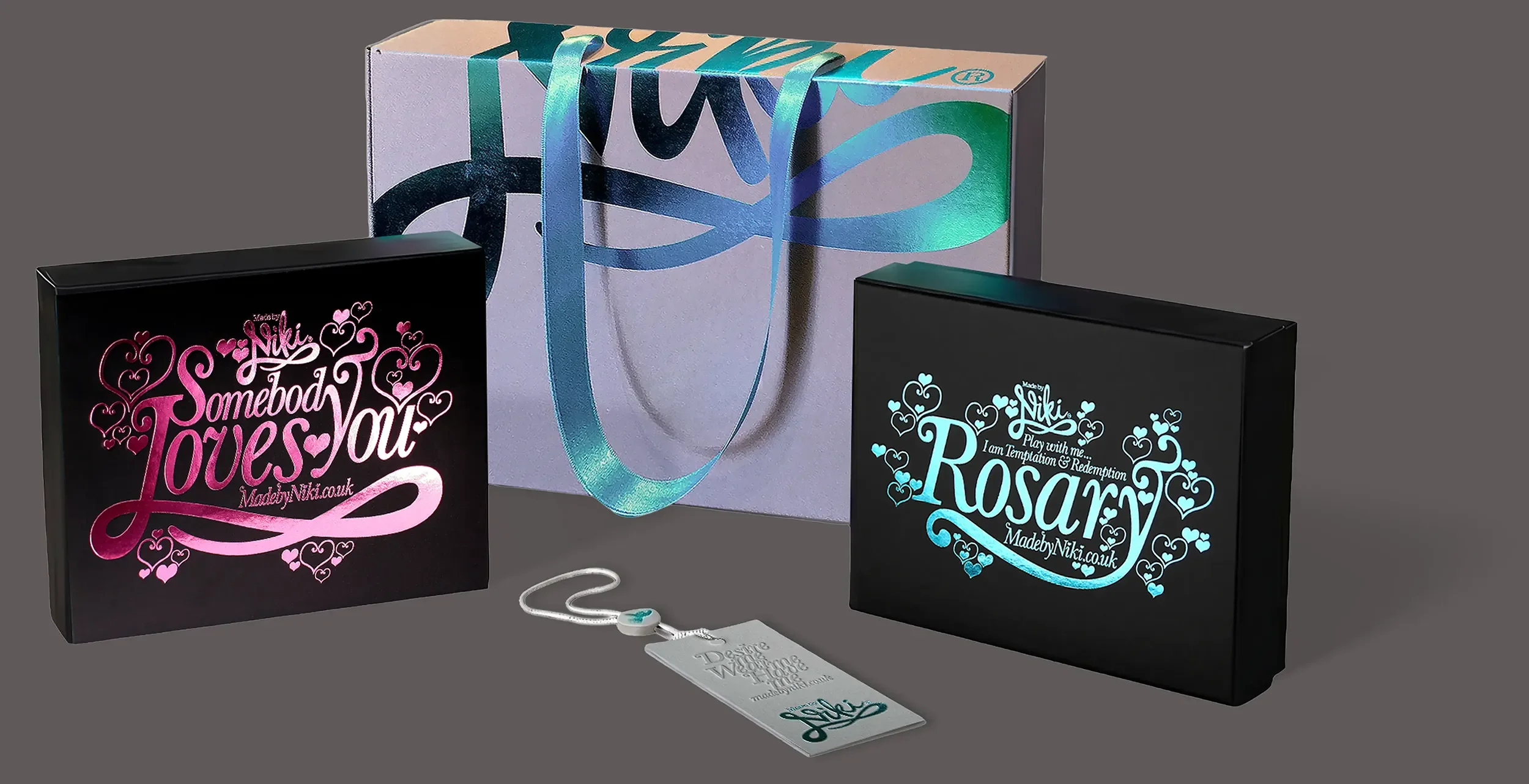 Creative packaging design solution with satin ribbon handle and abstract foil branding