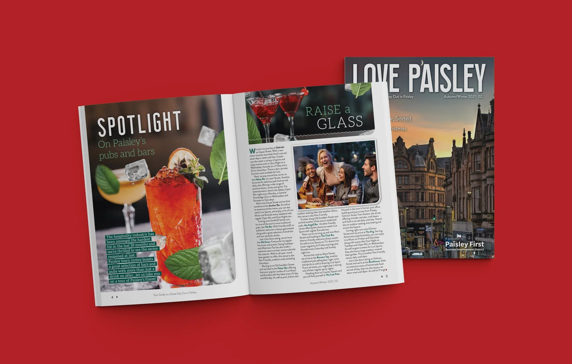 Open magazine showing articles about Paisley's pubs, bars, a social gathering, and a cityscape with historic buildings at sunset.