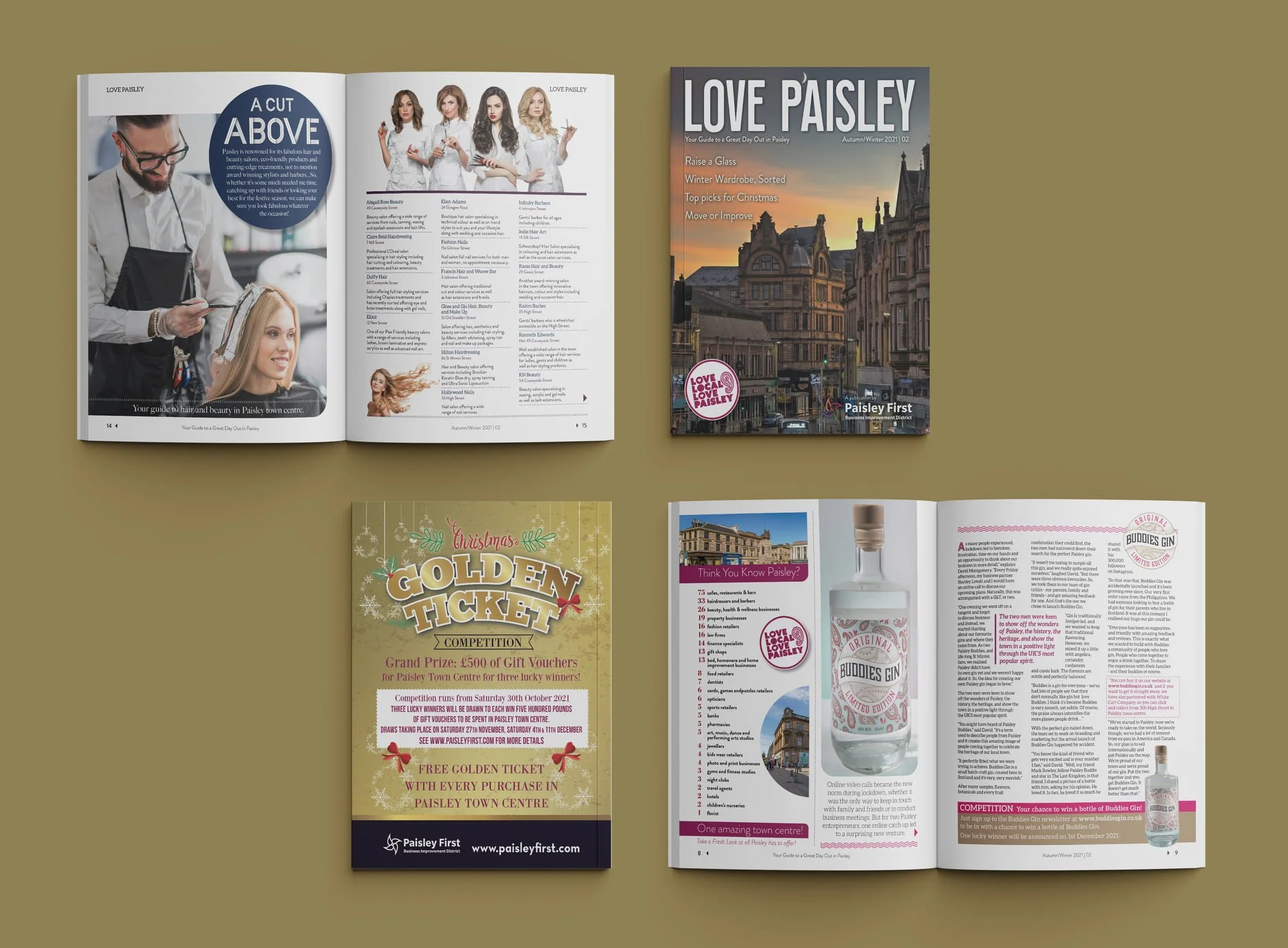 Open magazines and a brochure on a brown surface, including a hair salon guide, a city guide titled 'Love Paisley', a Christmas flyer for Paisley First with a golden ticket promotion, and an open magazine featuring a bottle of Buddies Gin.