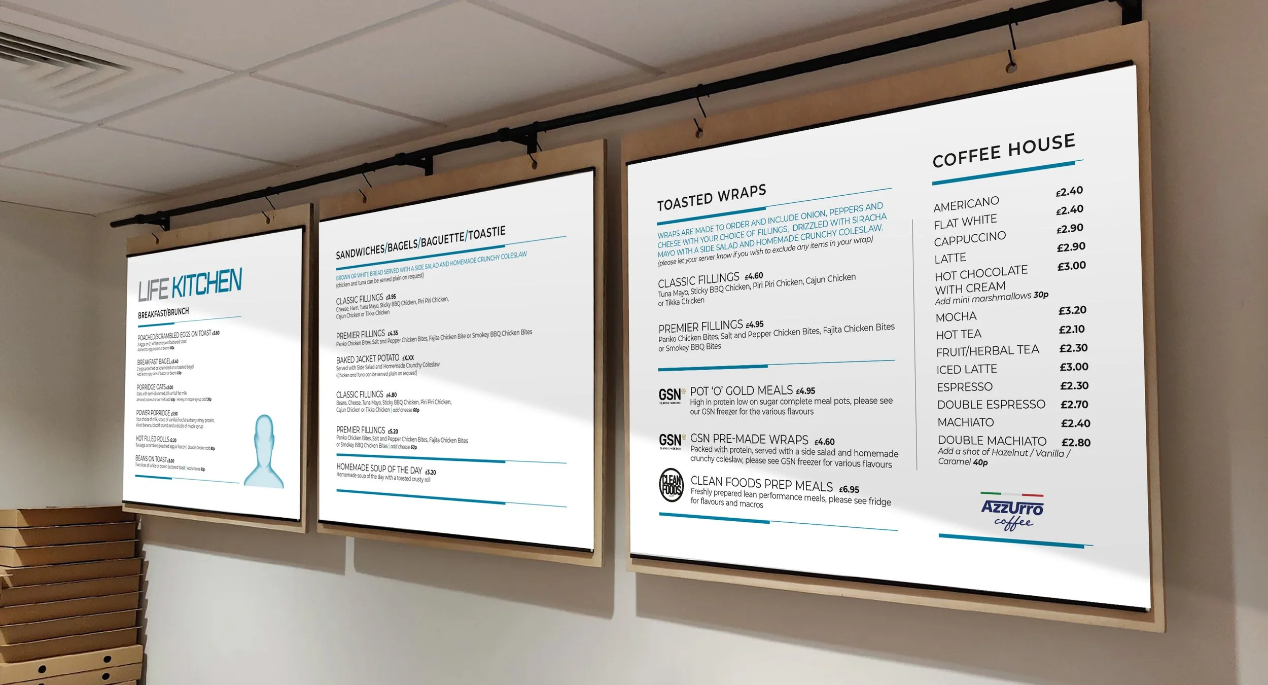 Three illuminated menu boards displaying food and beverage options in a cafe or restaurant, with a wooden bench visible beneath the left board.