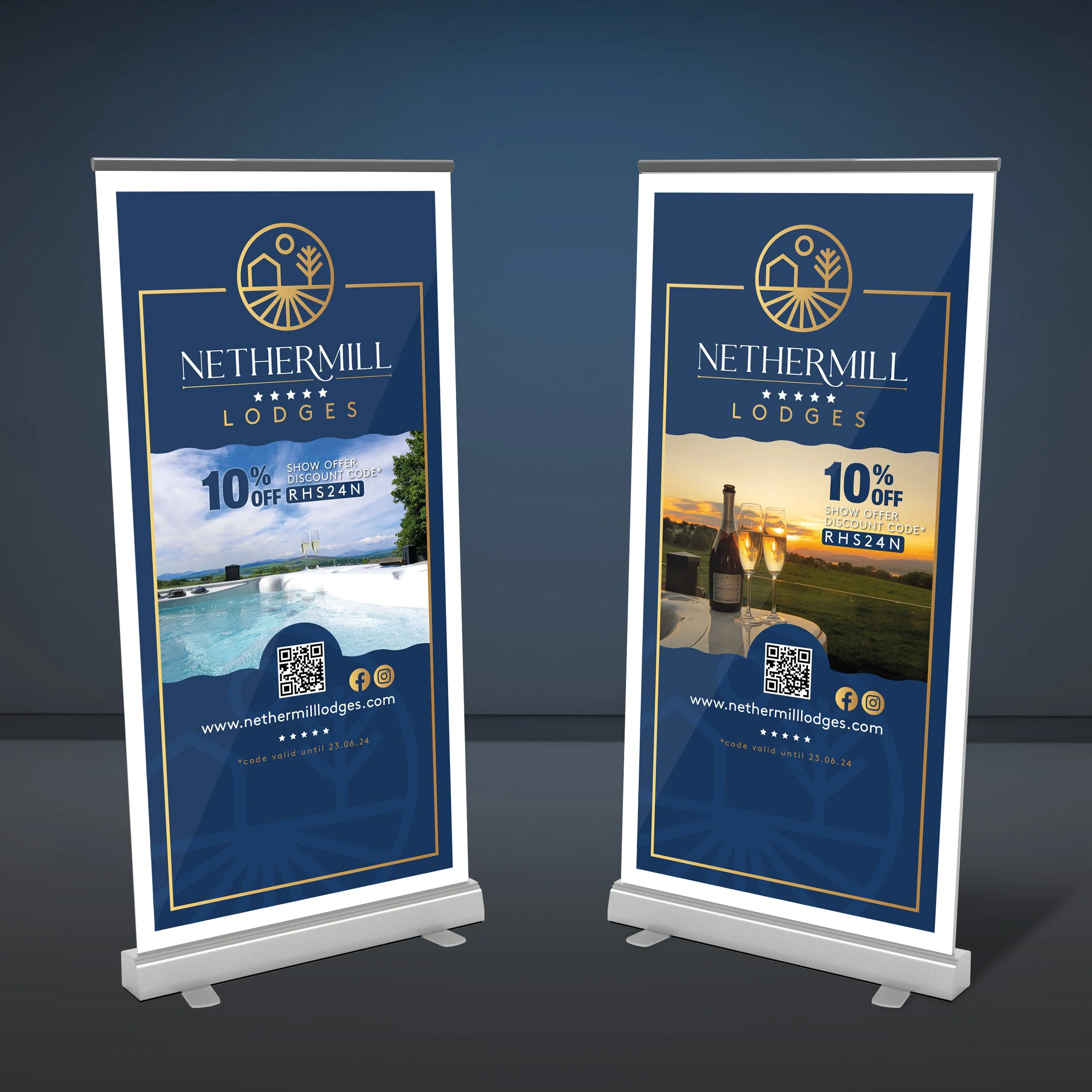 Two roll-up banners for NetheRmILL Lodges. The left banner features a swimming pool with a scenic mountain view, and the right banner shows a sunset with a bottle of champagne and glasses. Both banners include the logo, website, social media icons, a
