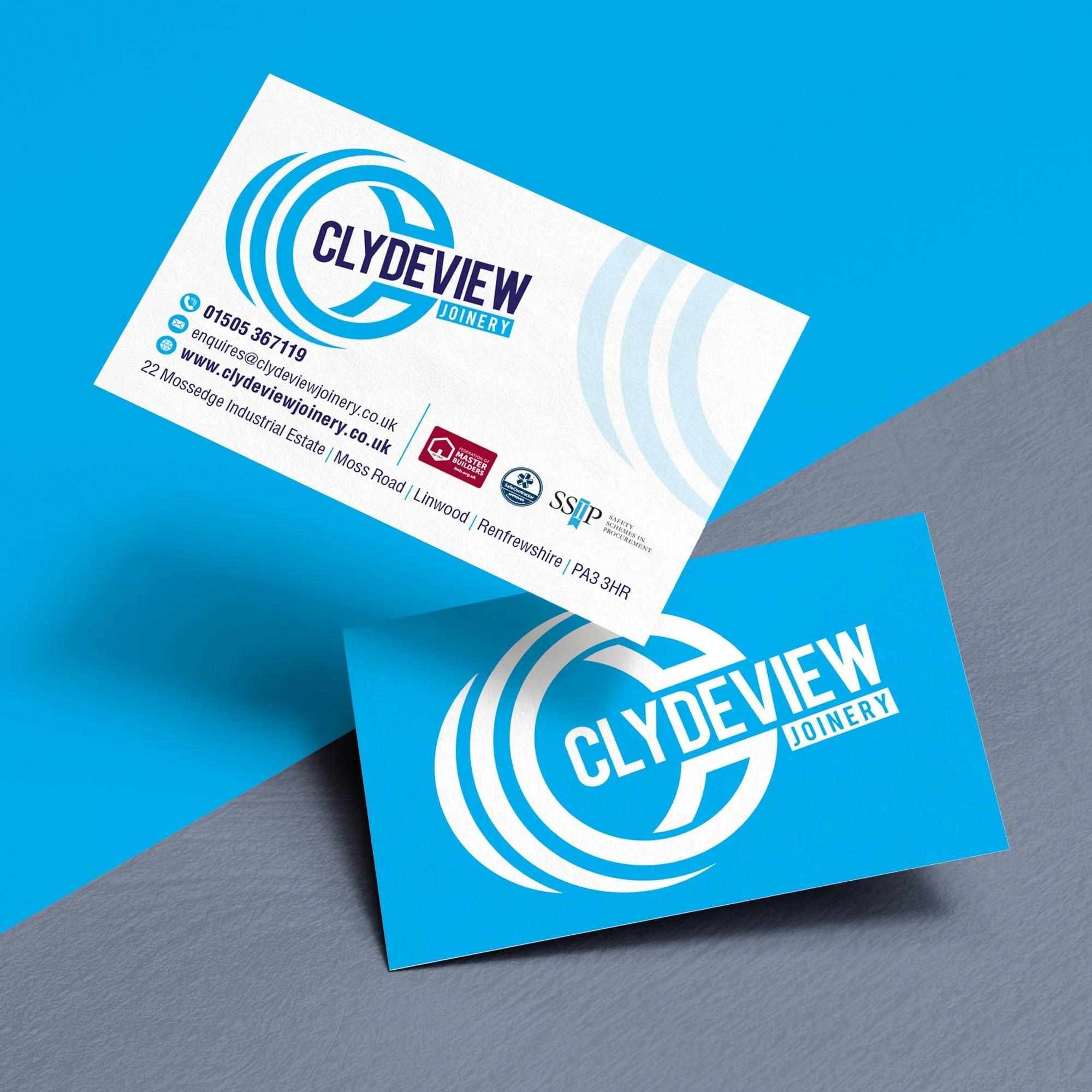 Business cards for Clydeview Joinery, featuring a blue and white logo, contact information, and accreditation logos, placed on a mixed blue and gray background.