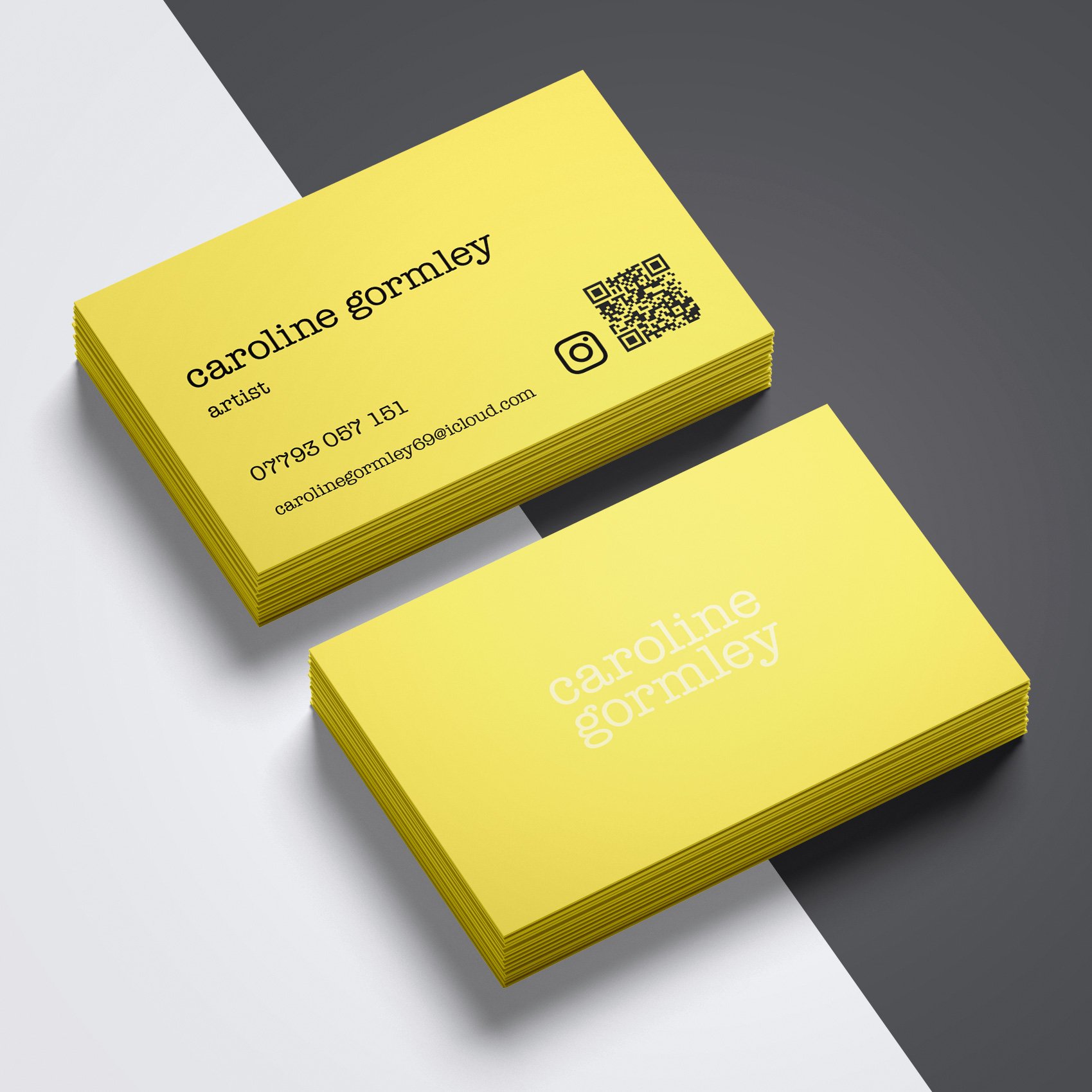 Stack of yellow business cards for artist Caroline Gormley with contact info, Instagram icon, and QR code on a gray and white background.