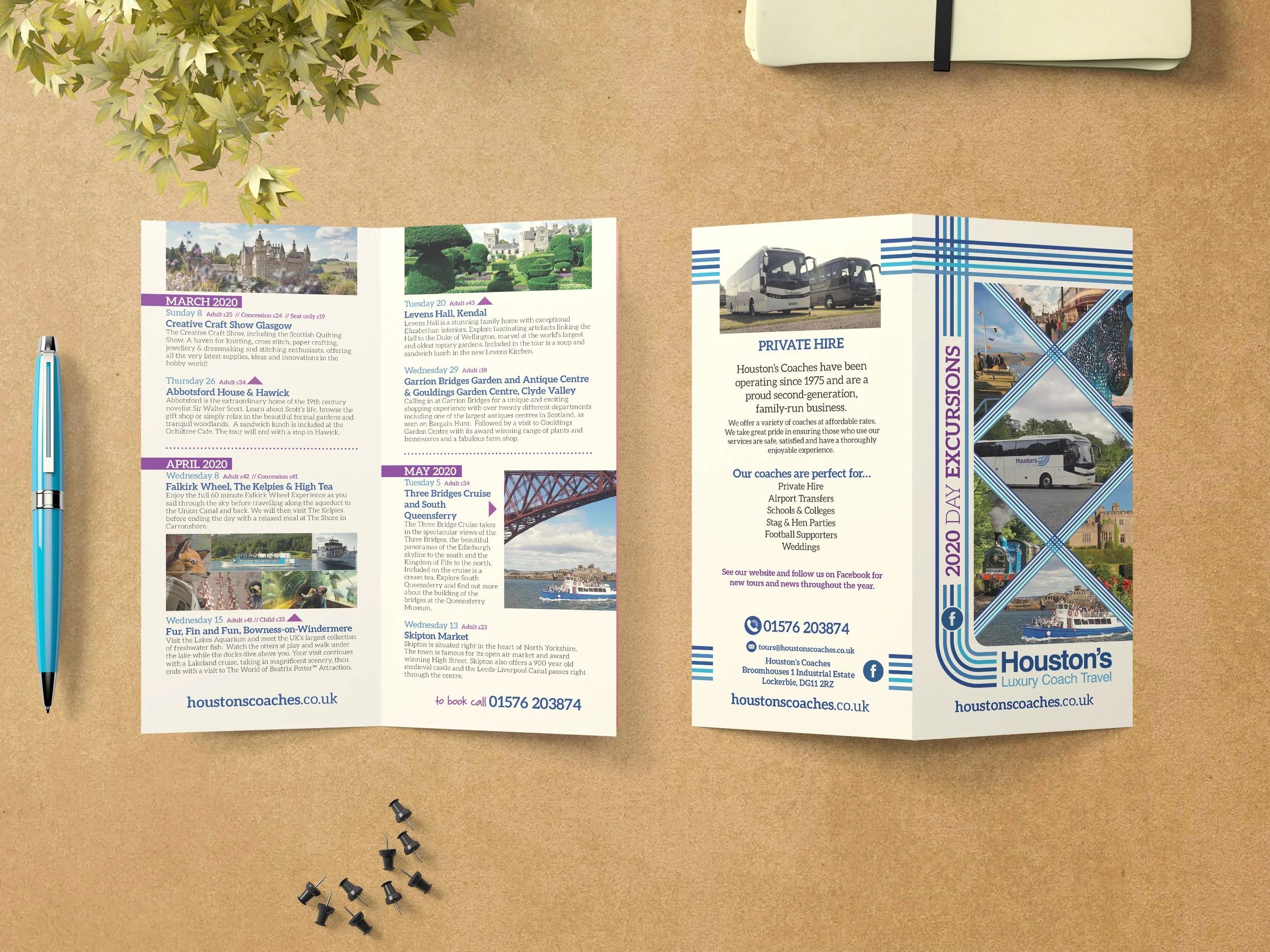 Open brochure for Houston's luxury coach travel on a brown desk with a pen, a small plant, and several black push pins.