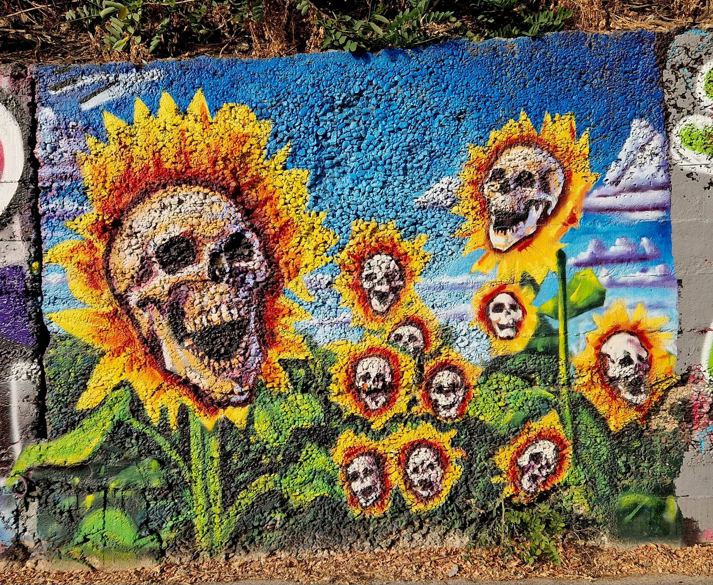 Skull flowers, exterior mural by Matthew Rush Elmore.