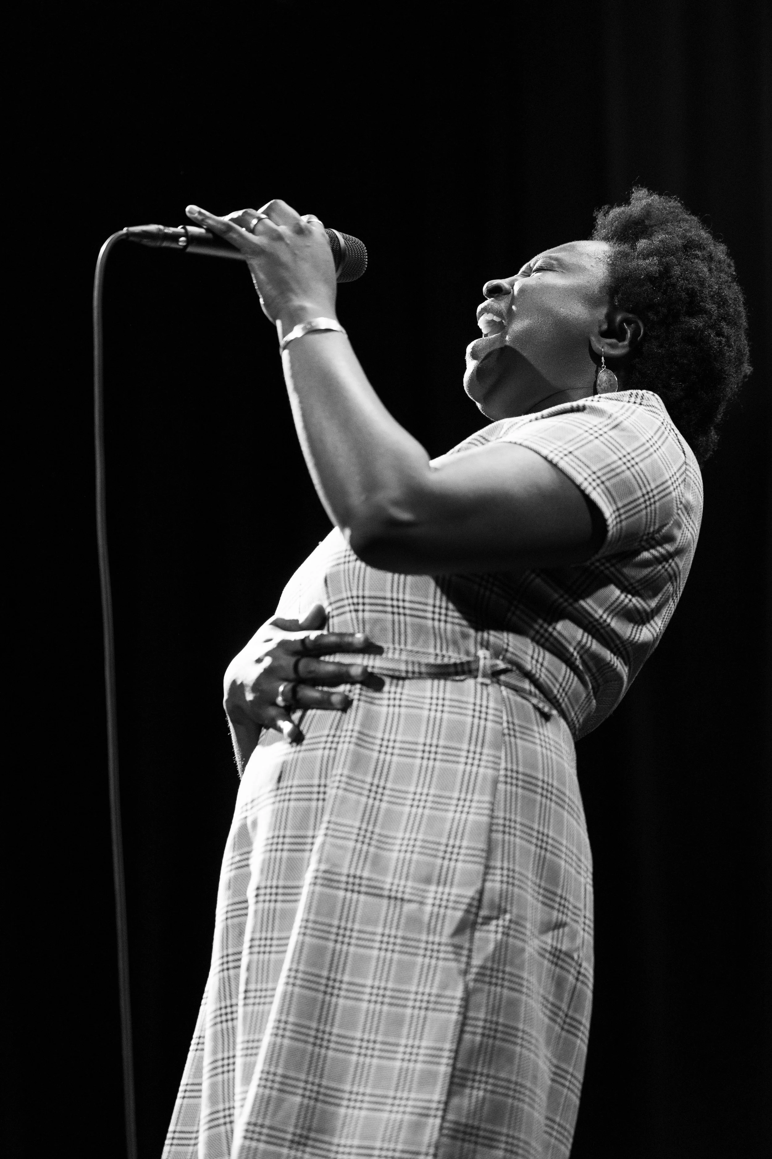 Rohey Taalah singing on stage