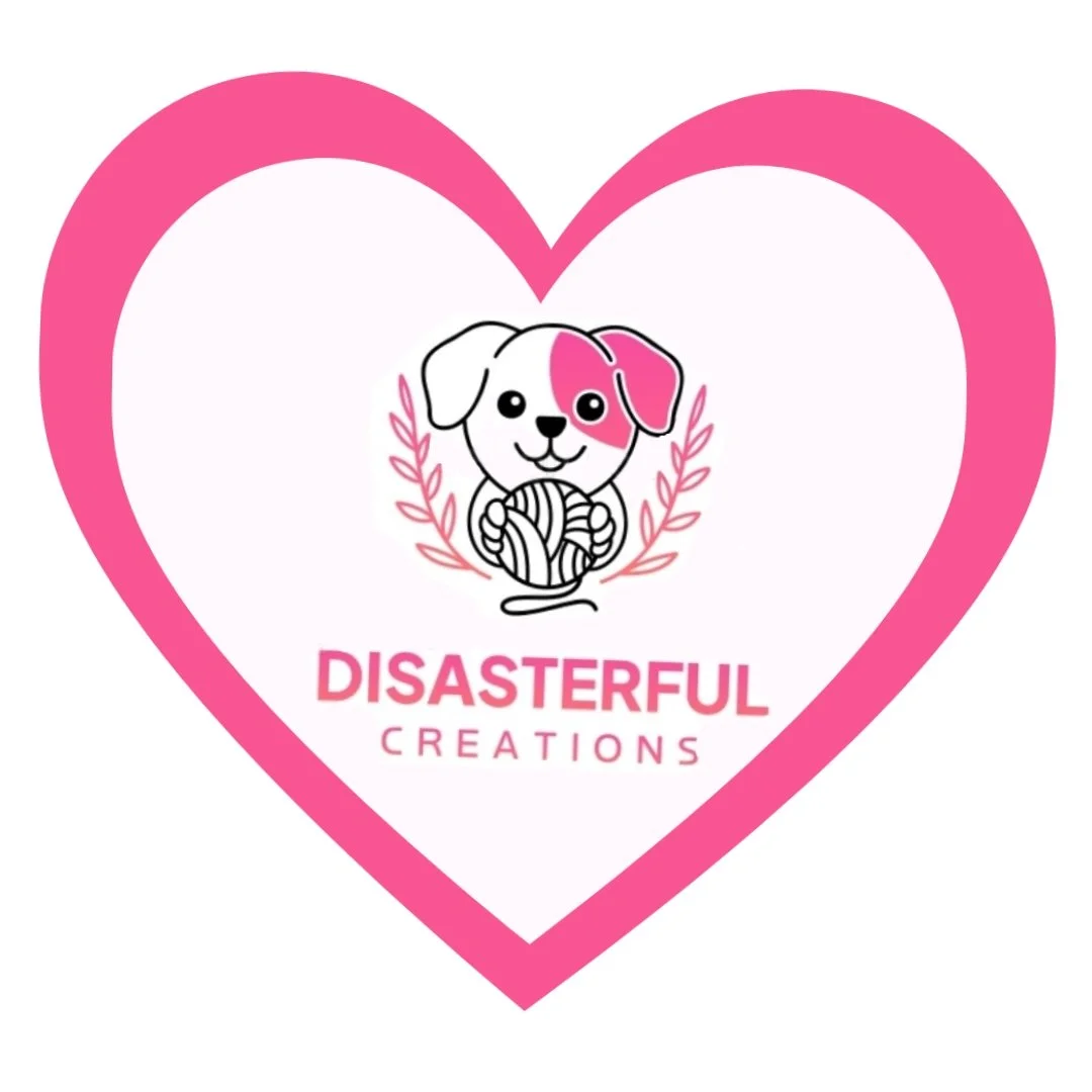 A logo with a pink heart outline, featuring a cartoon dog holding yarn, with the words 'Disasterful Creations' below.