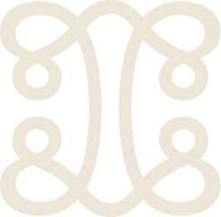 Symmetrical black and white decorative design with swirling patterns