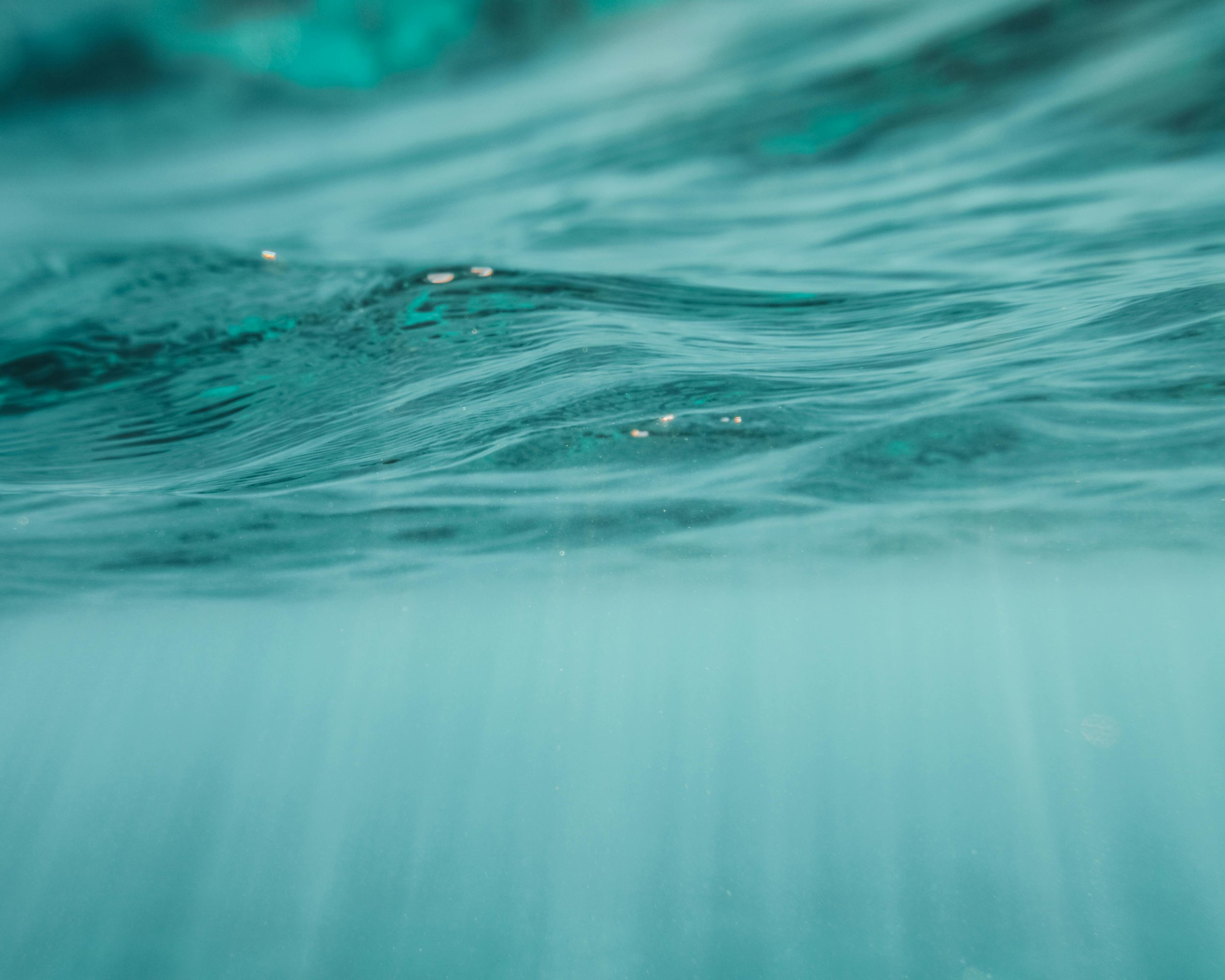 Close-up of ocean water with ripples and light reflection.