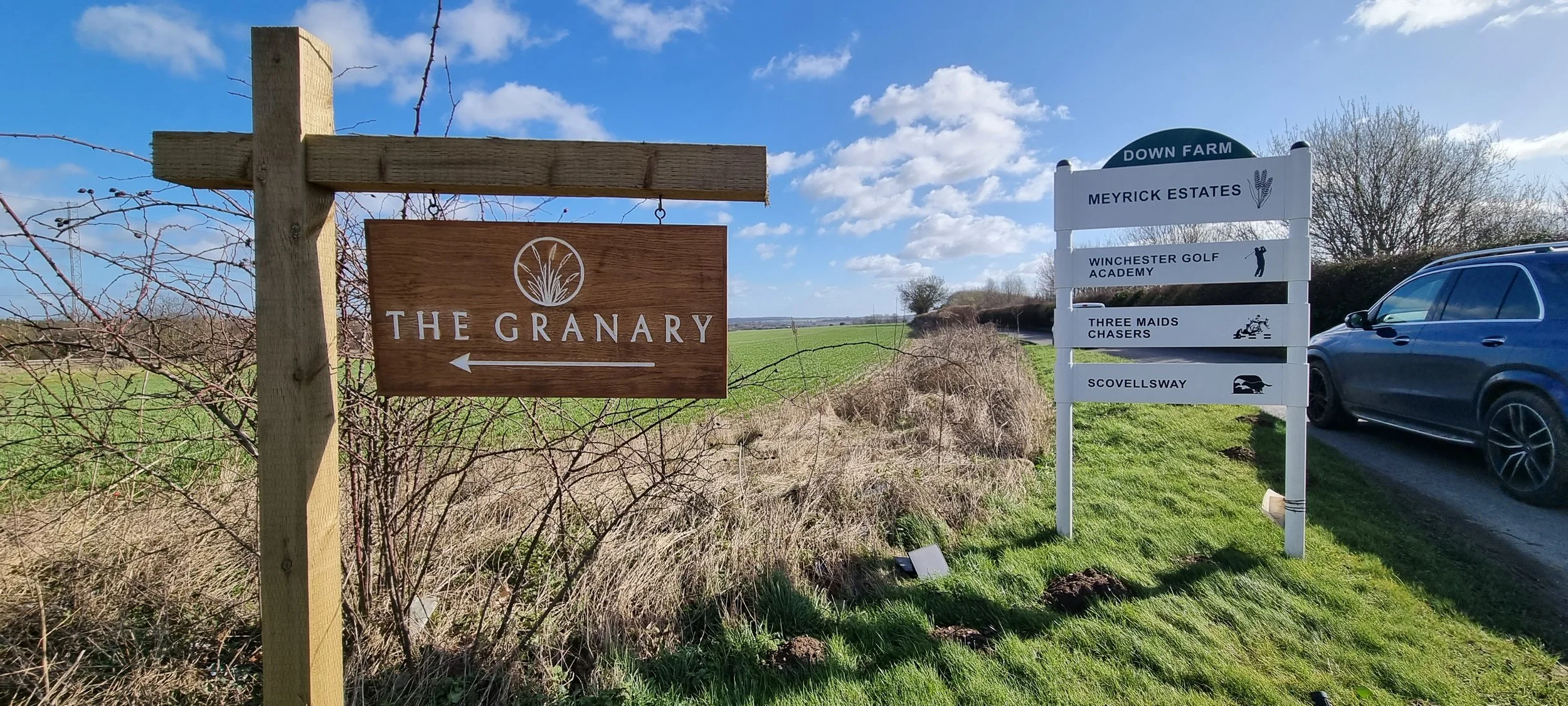 Custom signage with painted infill for The Granary