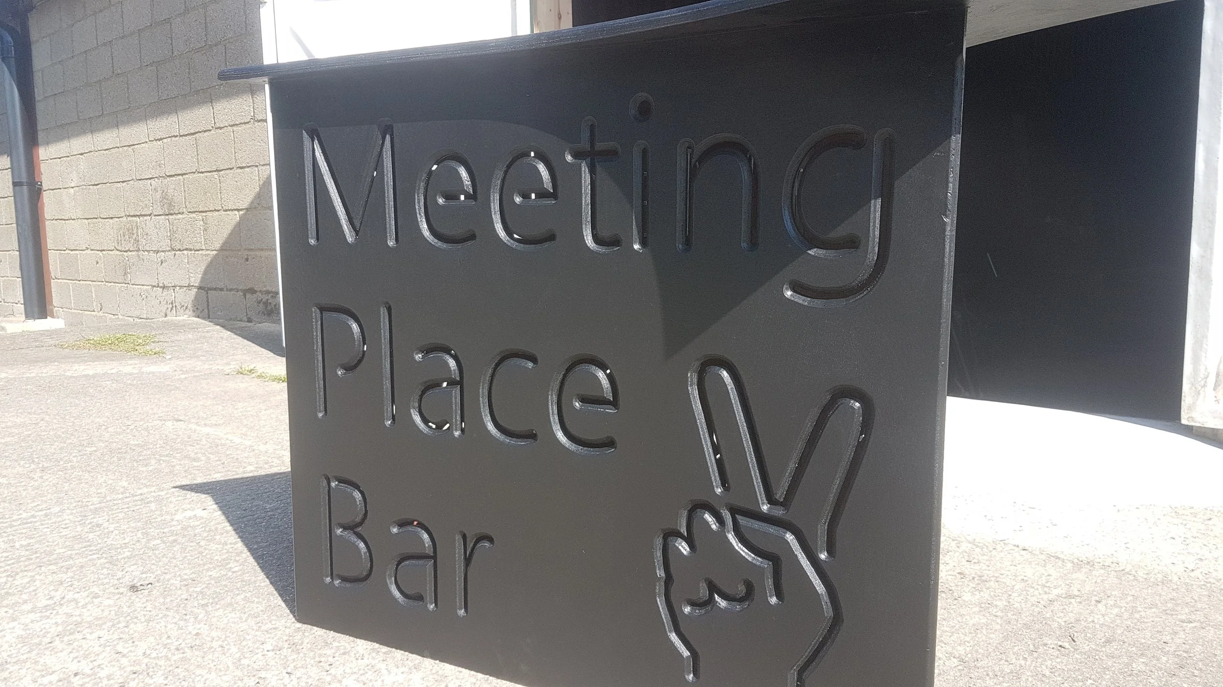 Custom backlit signage for The Meeting Place Bar, Glastonbury Festival