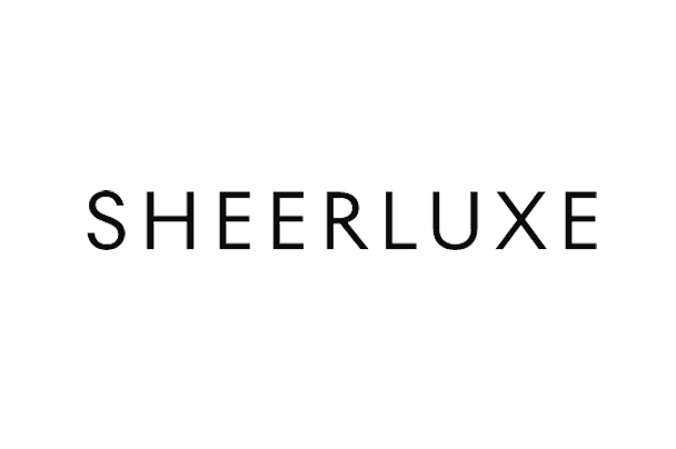 The logo features the word 'SHEERLUXE' in uppercase letters with a metallic, shiny appearance, set against a black background.
