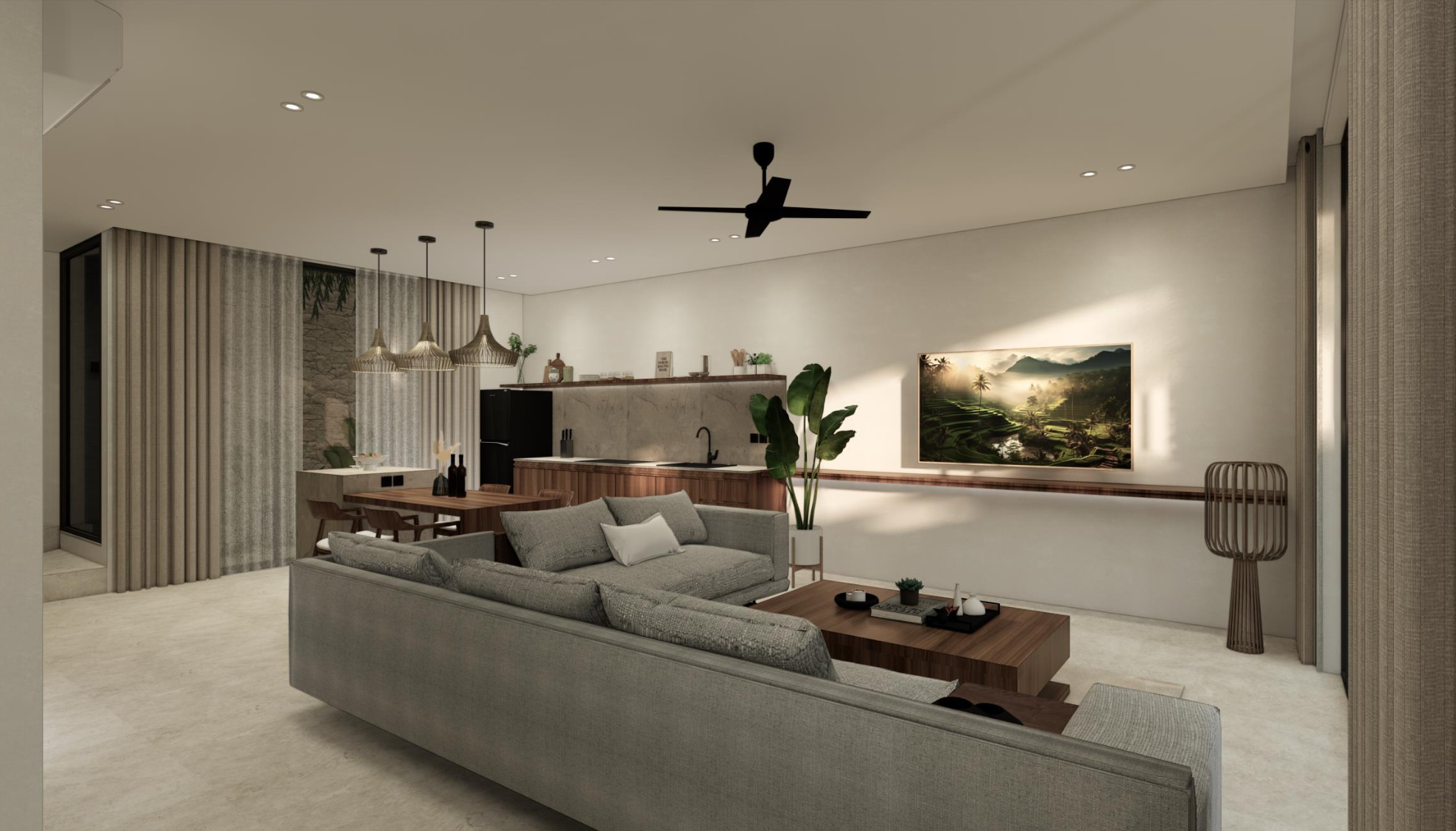 Modern living room with grey sectional sofa, wooden coffee table, large wall-mounted TV, potted plant, and open kitchen area with pendant lights and a seating area.