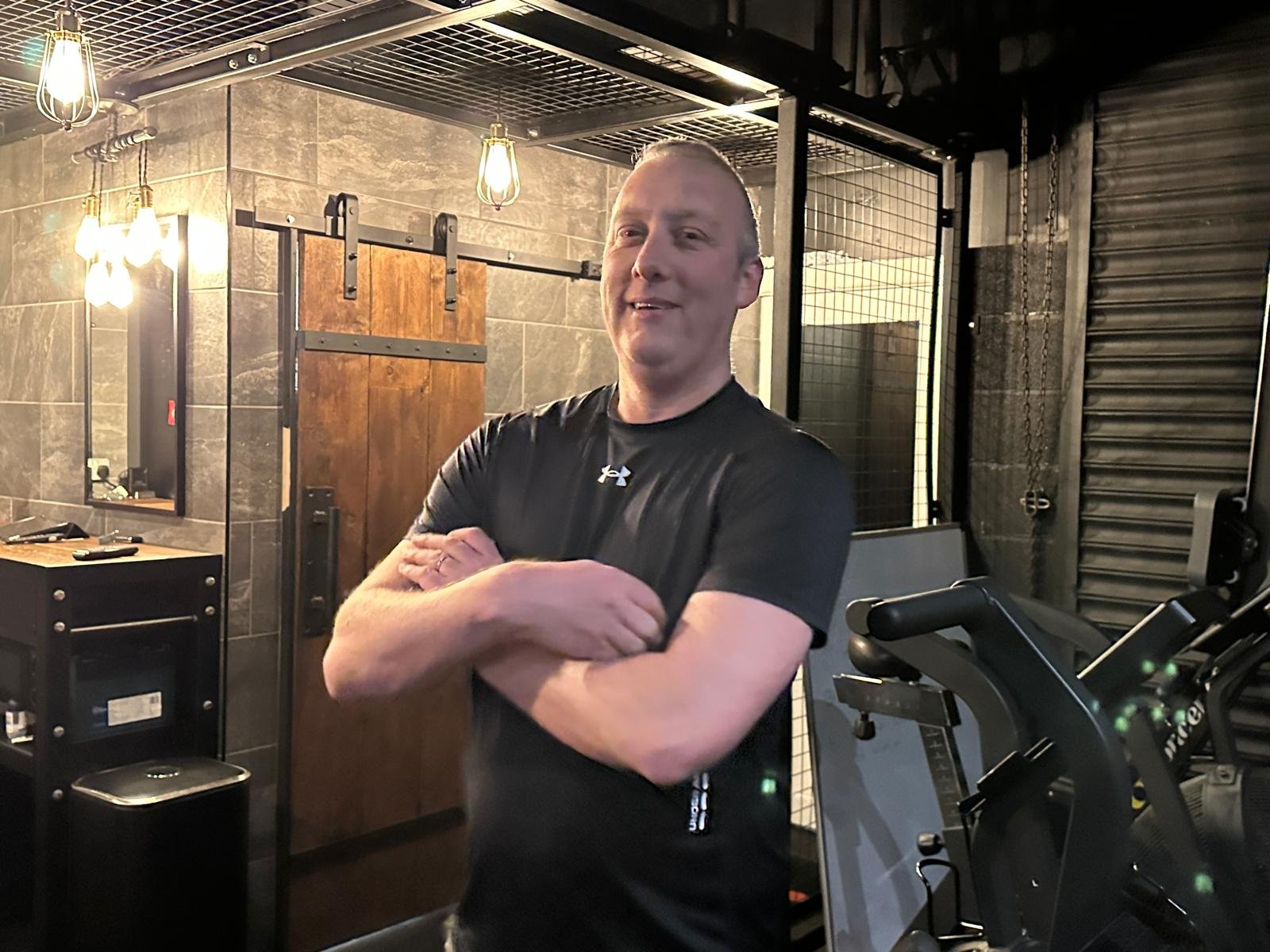 Greg poses for the camera in front of Alta Zenith's reception