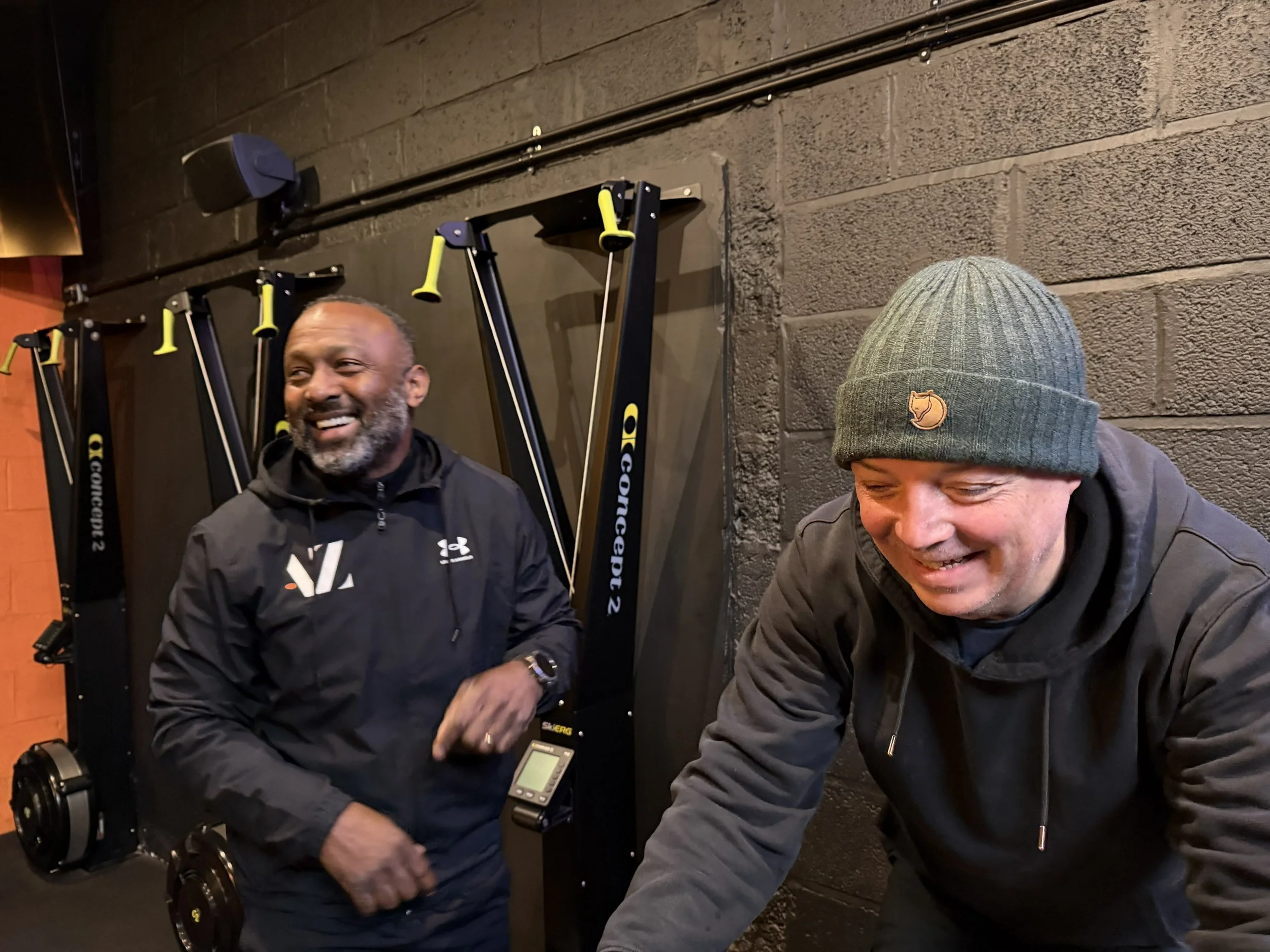 Charlie is being coached by Alta Zenith's Gary Roberts on an exercise bike