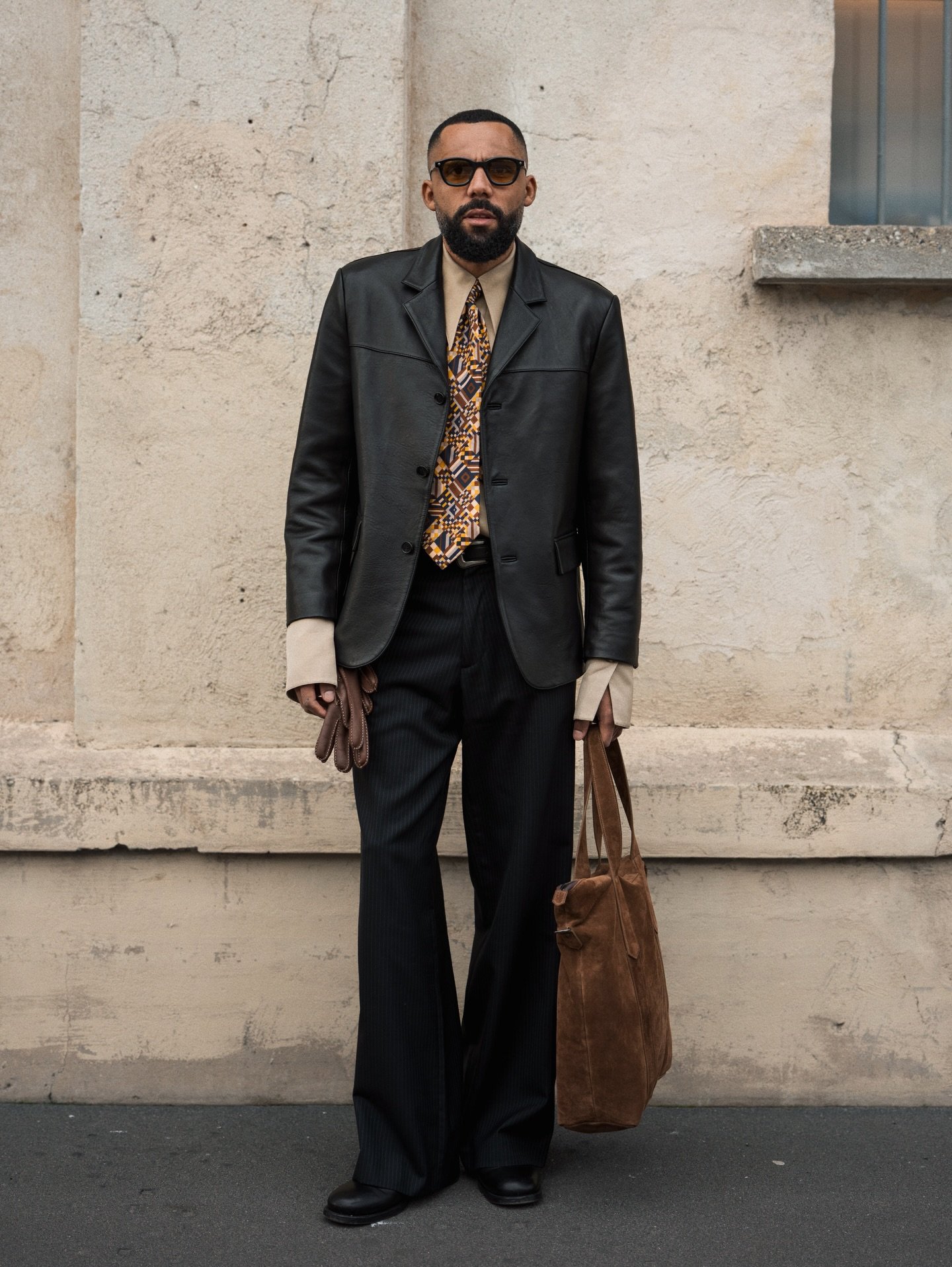 Milan Fashion week day 3 wearing a 70&lsquo;s inspired look featuring this black leather blazer from @tonywack_official. Perfect attire to step int the @prada FW26 universe, which focuses on deep layers and lived-in textures. A collection that feels 
