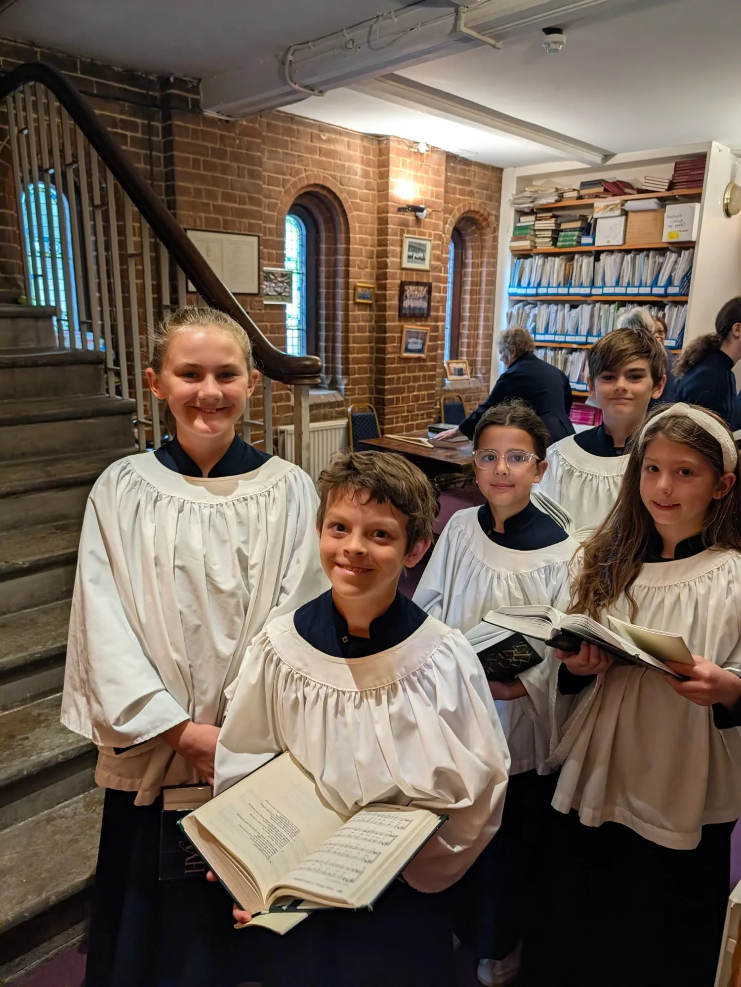 junior choir members stand in the vestry preparing for the Sunday Service