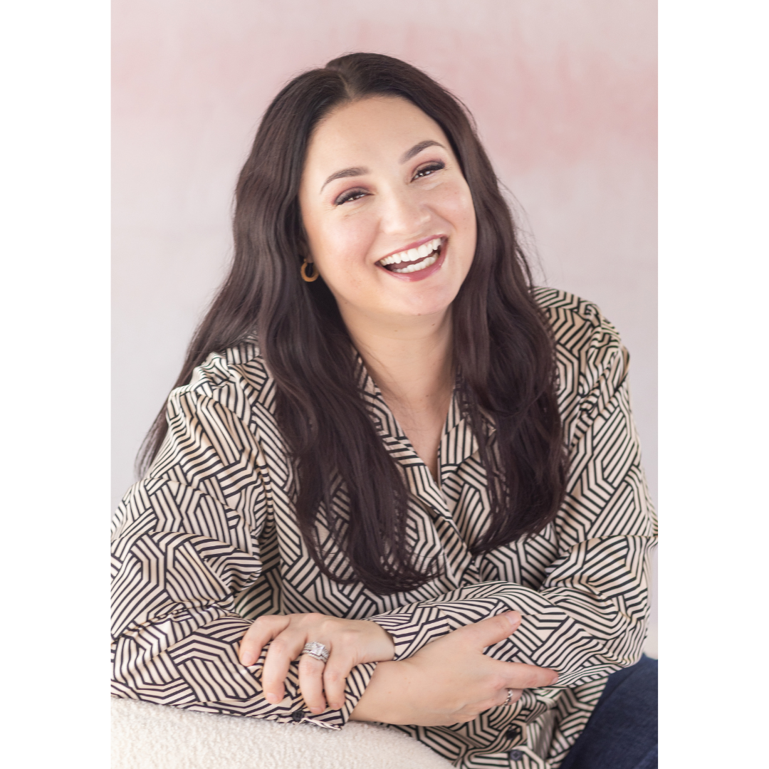 Portrait of a beautiful Greek woman laughing while having her photo taken.
