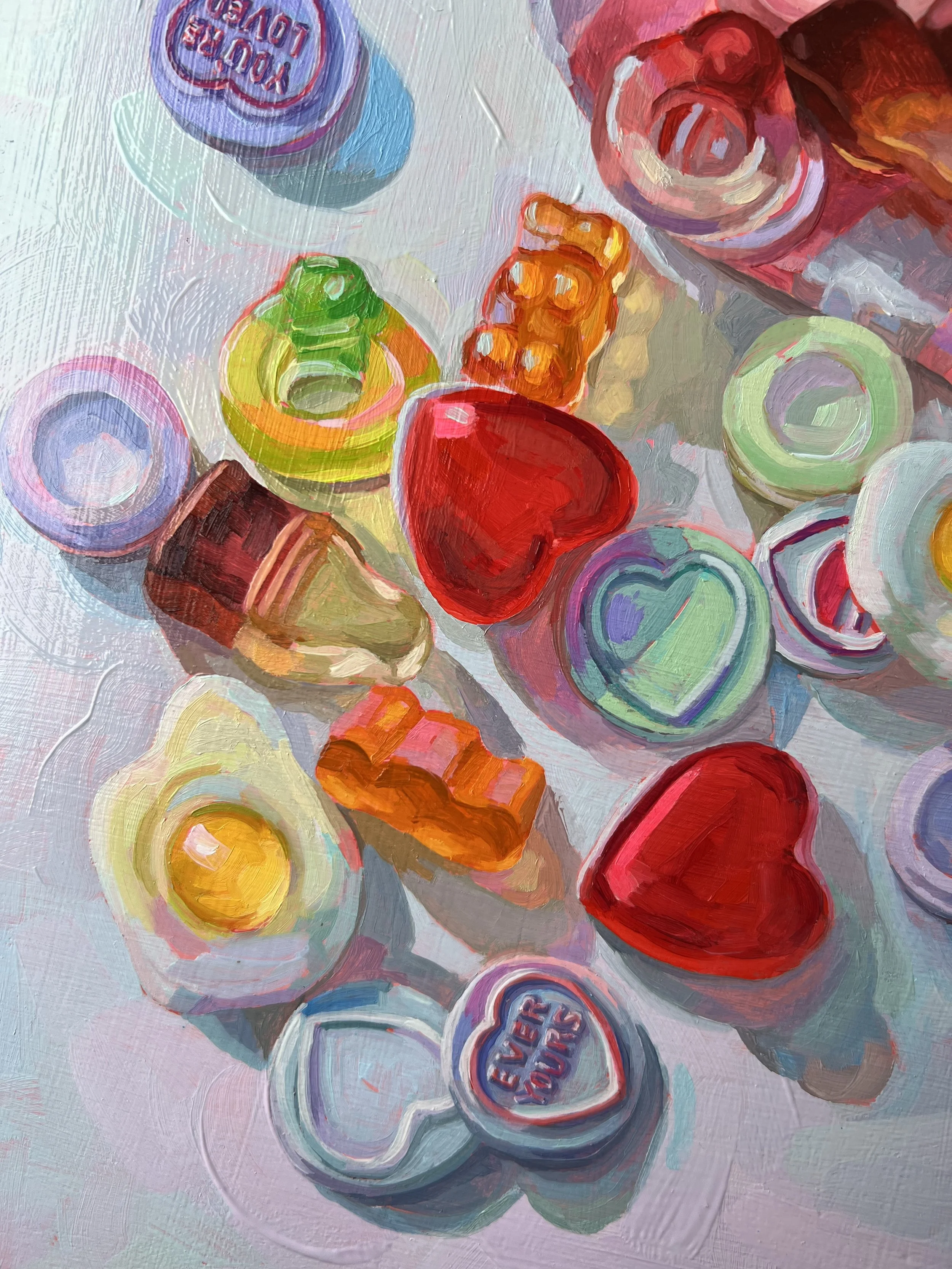 A painting of a colorful assortment of candy hearts and gummies scattered on a surface.