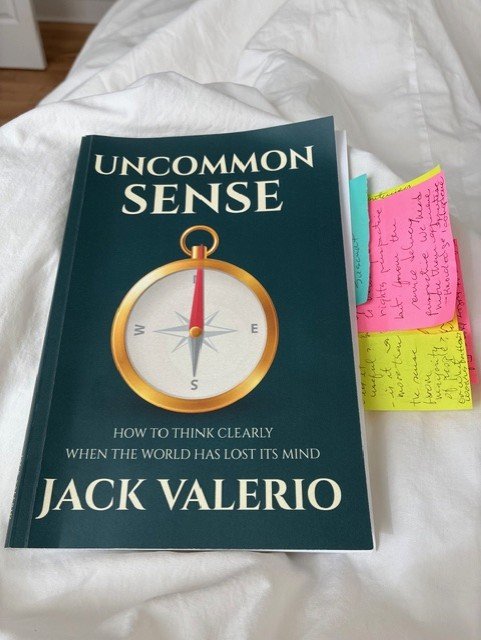 Ara's copy of Uncommon Sense by Jack Valerio marked with tabs for passages and ideas she wanted to revisit.