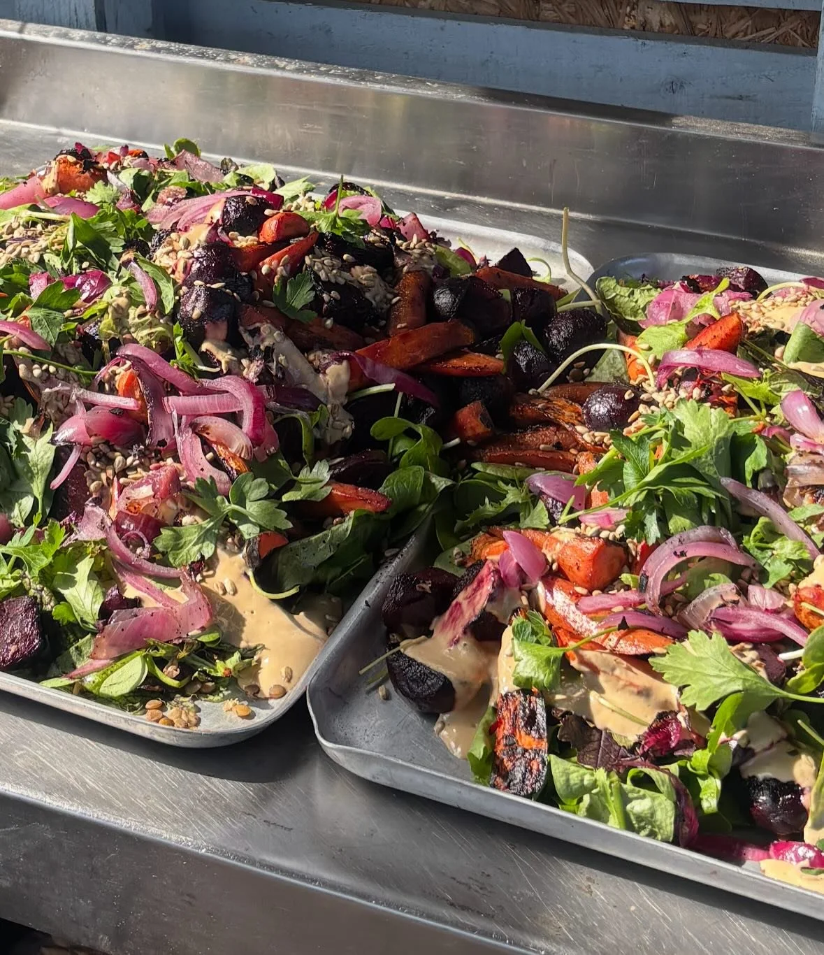 The bbq got lit for our huge crew of volunteers today. We served a BBQ&rsquo;d carrot, beetroot &amp; onion salad with green lentils, @kindlingtrust greens and a roasted garlic and tahini dressing.