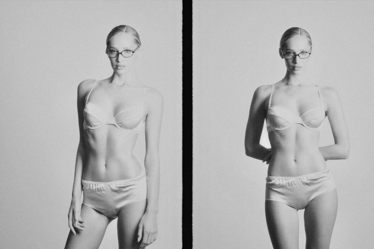 Black and white photograph of a woman in a two-piece lingerie set, wearing glasses, with her hair pulled back. She poses in front of plain background, with a neutral expression, shown twice in different stances.