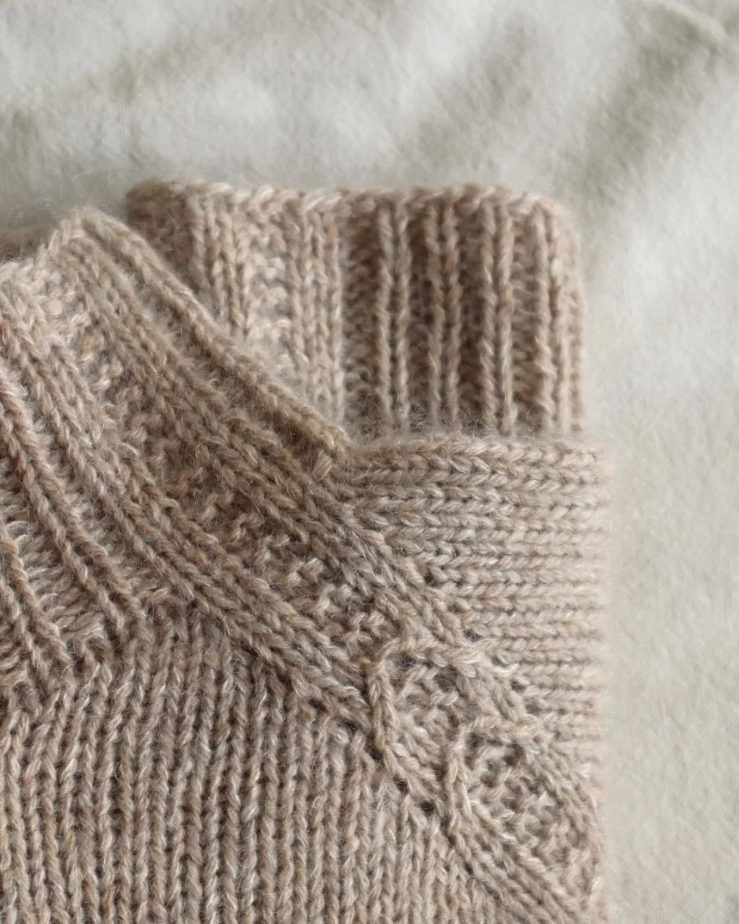 I like playing with textures. They're not complicated to knit and can make a design element that stands out.

On the Woven Arches Sweater I played around with the ribbing to create this interesting raglan detail that runs from the neckband down to th