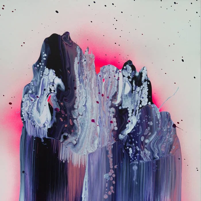 Abstract painting of a mountain with purple, black, white, and pink colors, with splashes of paint around it.