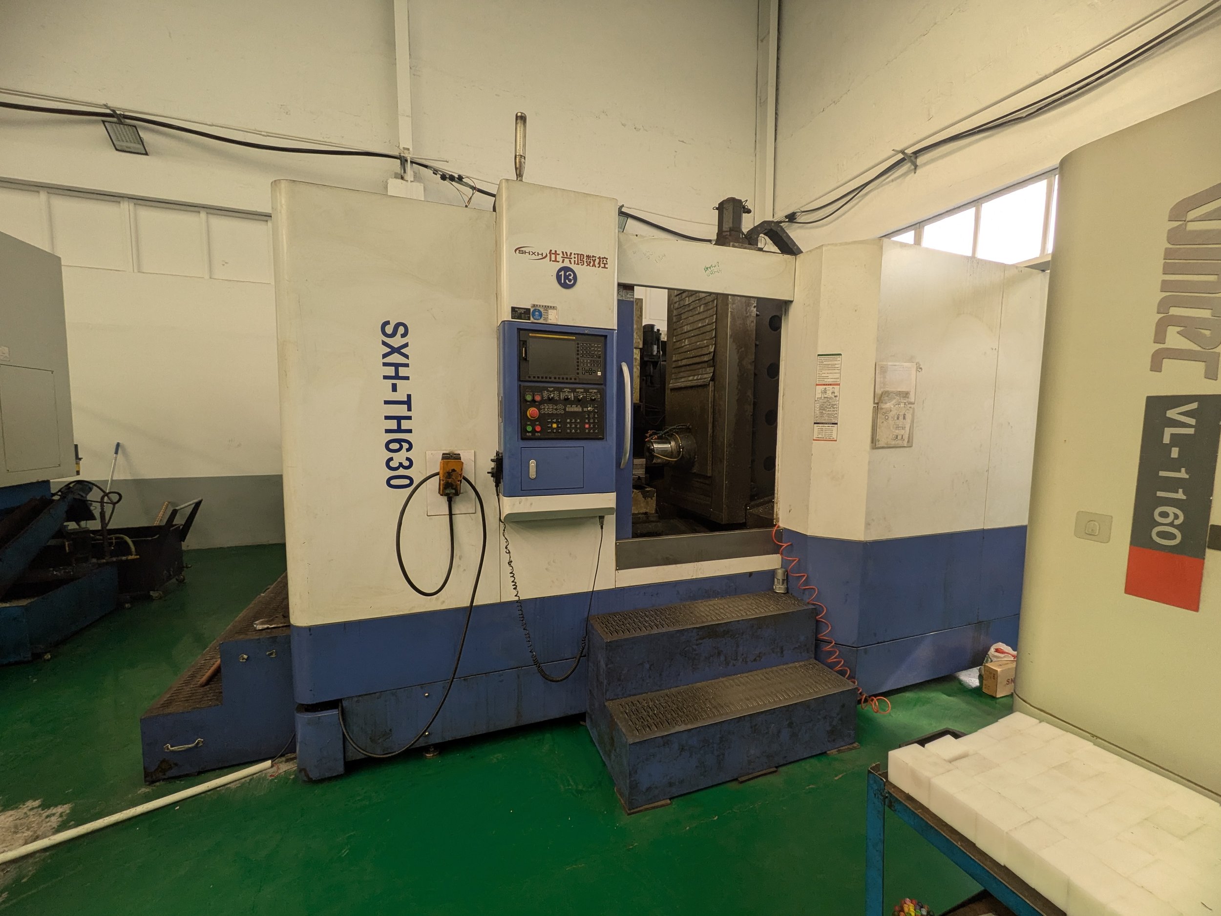 Industrial CNC machine in a workshop.