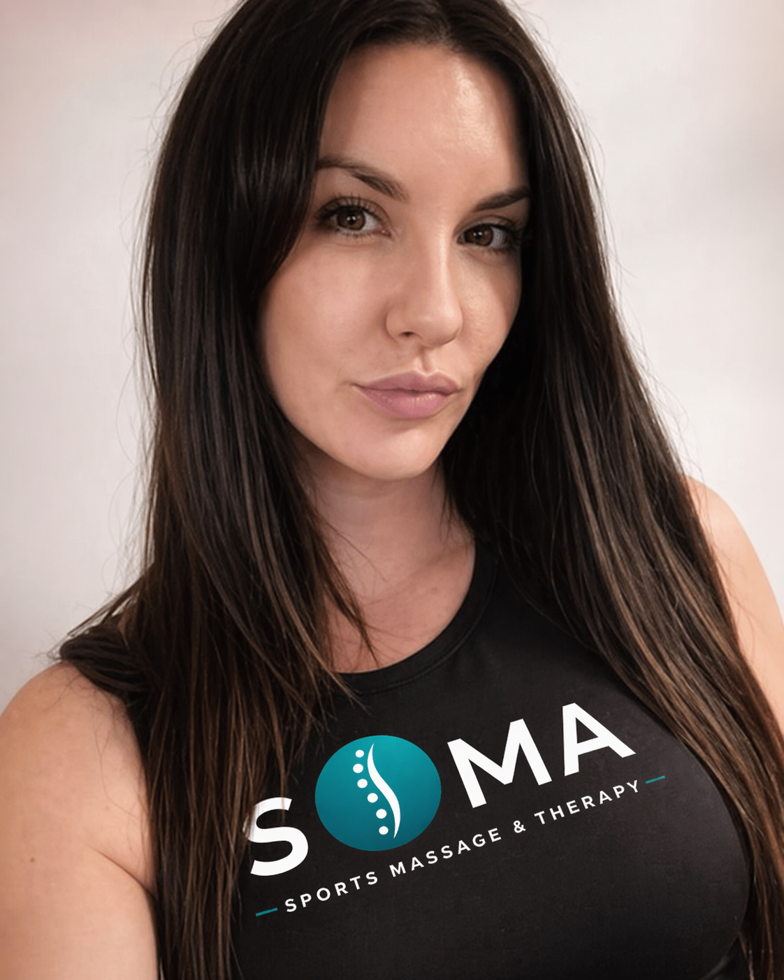 Sports Therapist wearing a SOMA Therapy Logo T-shirt