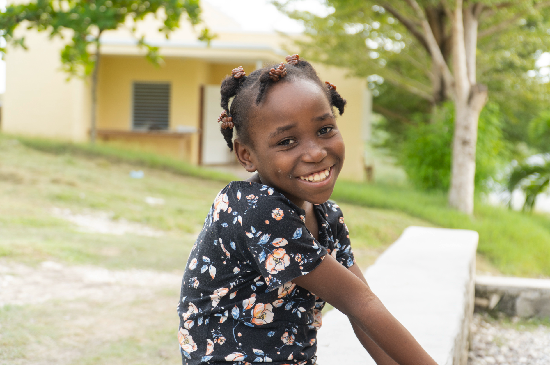 Little girl smiling shyly