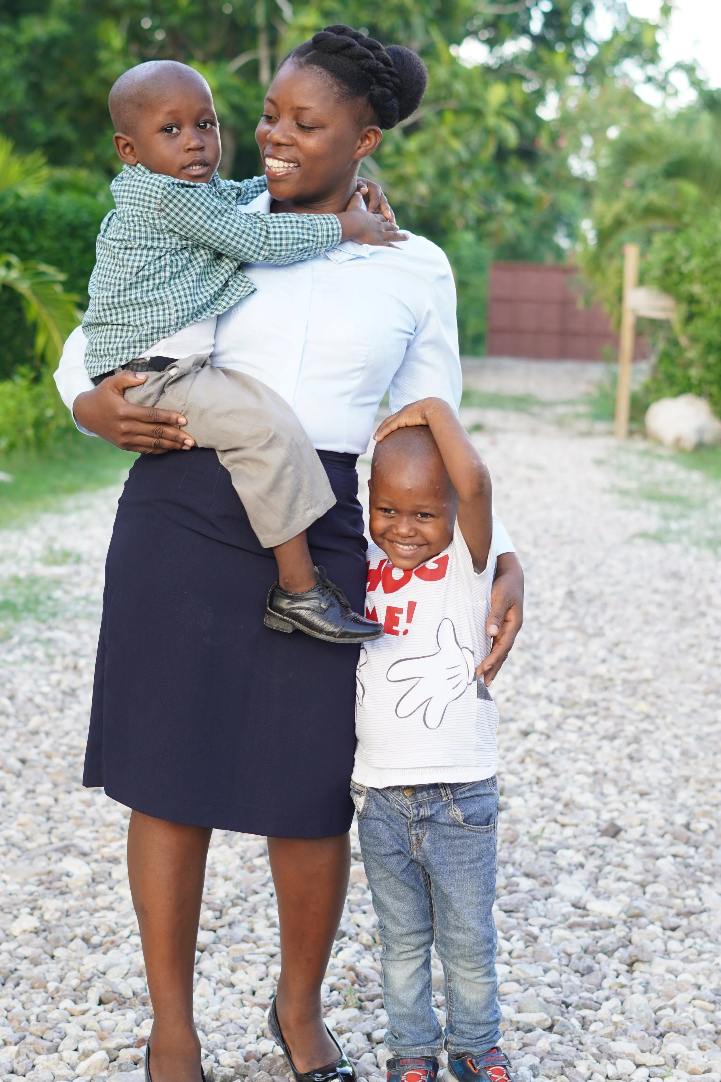 Haitian mother holding two of her little boys.