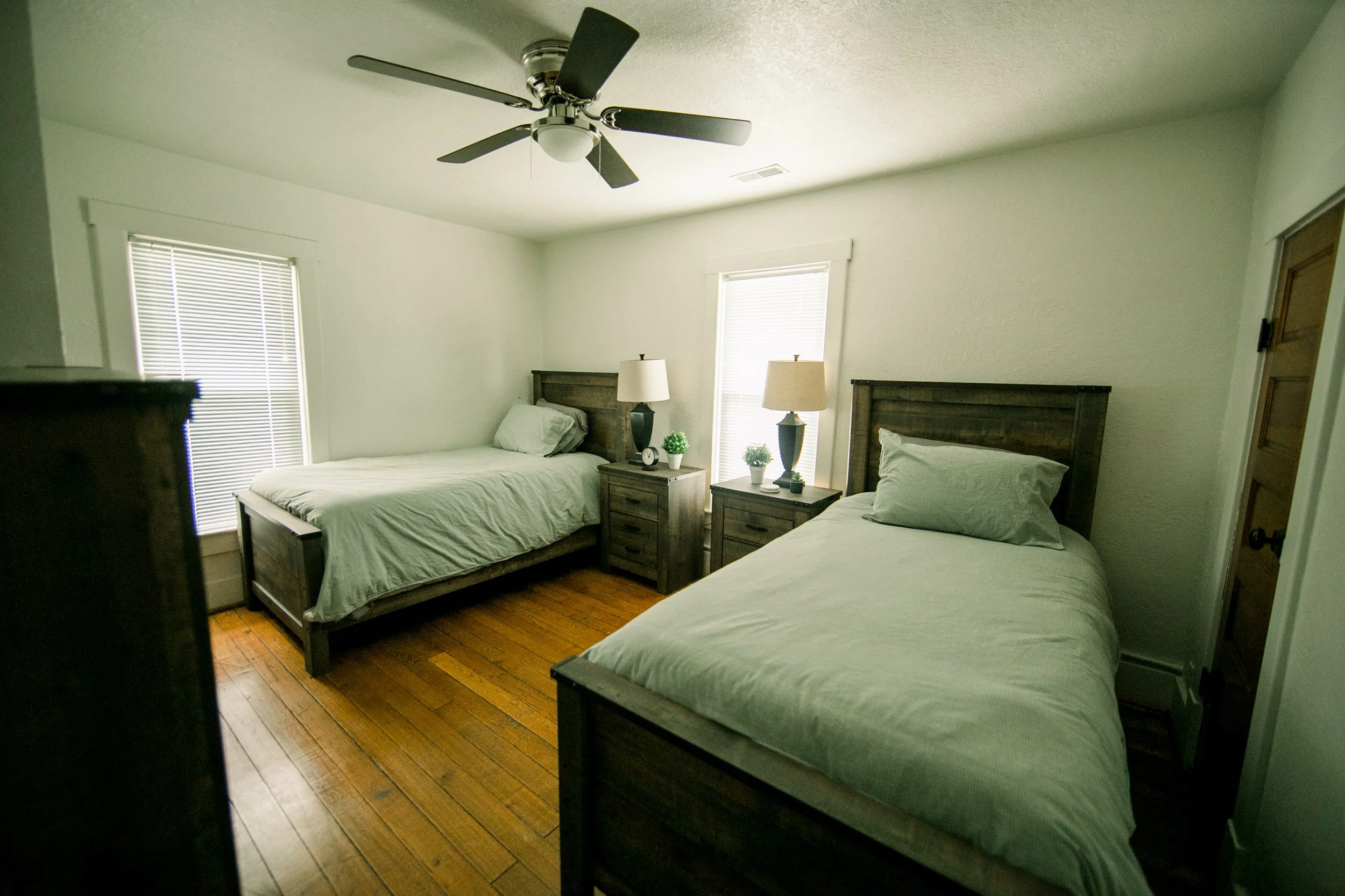 Two twin beds with lamps. 