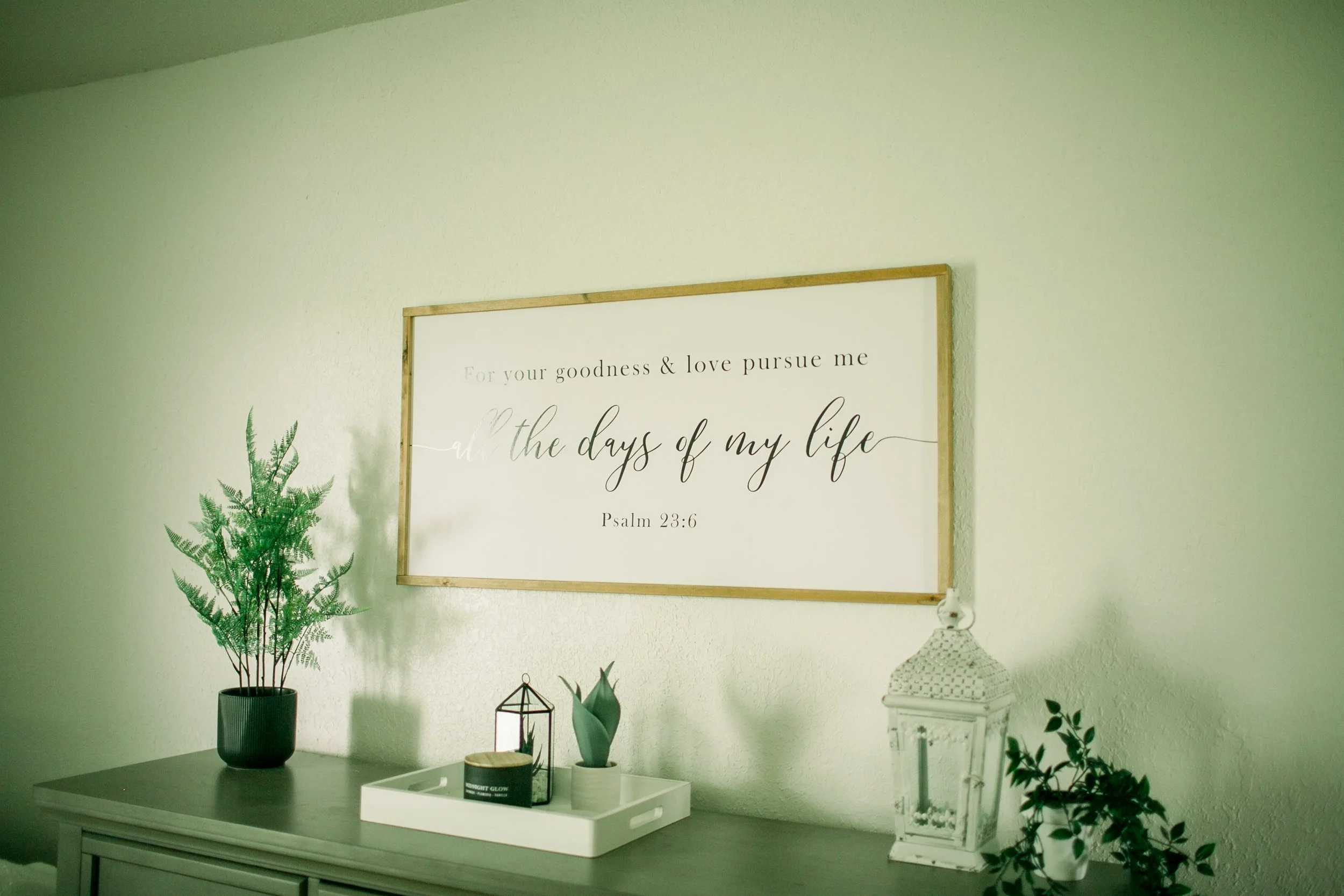 Dresser with a sign over it saying: For your goodness and love pursue me all the days of my life. Psalms 23:6