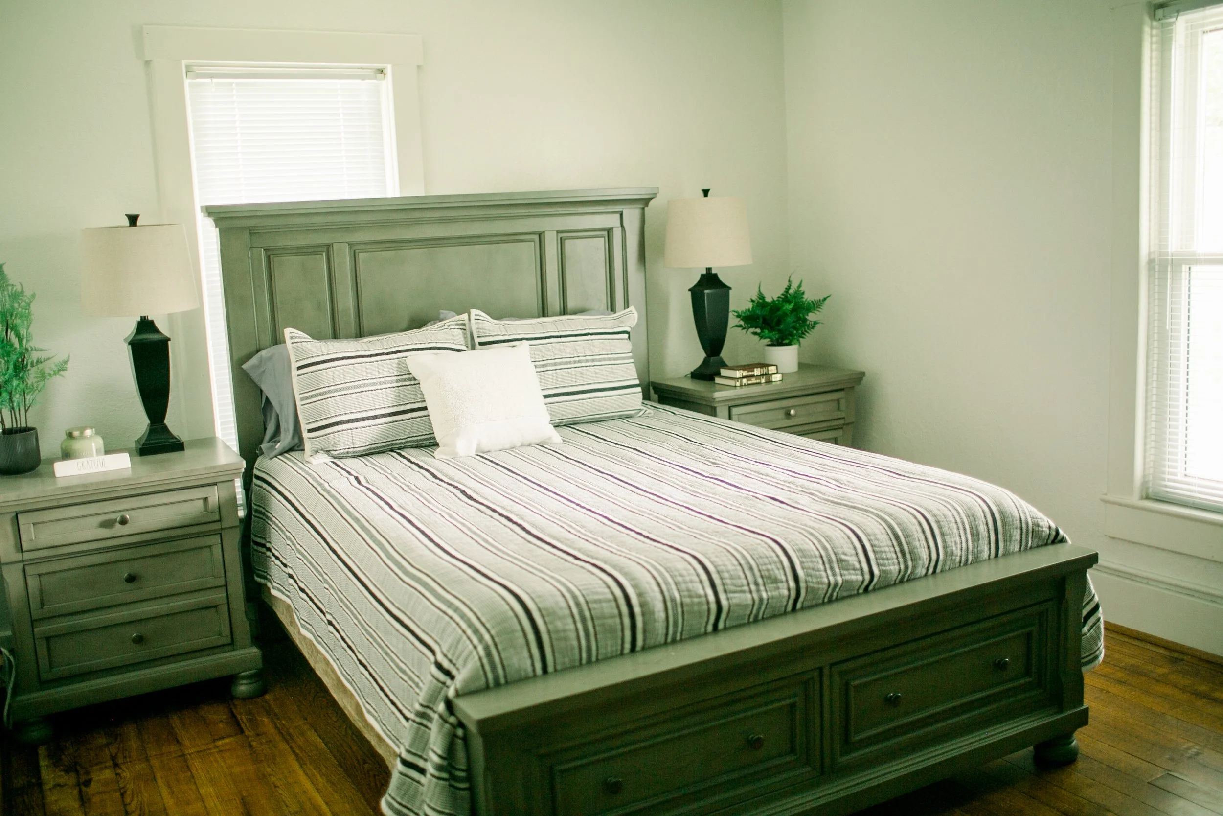 Queen-sized bed with bed-side tables. 