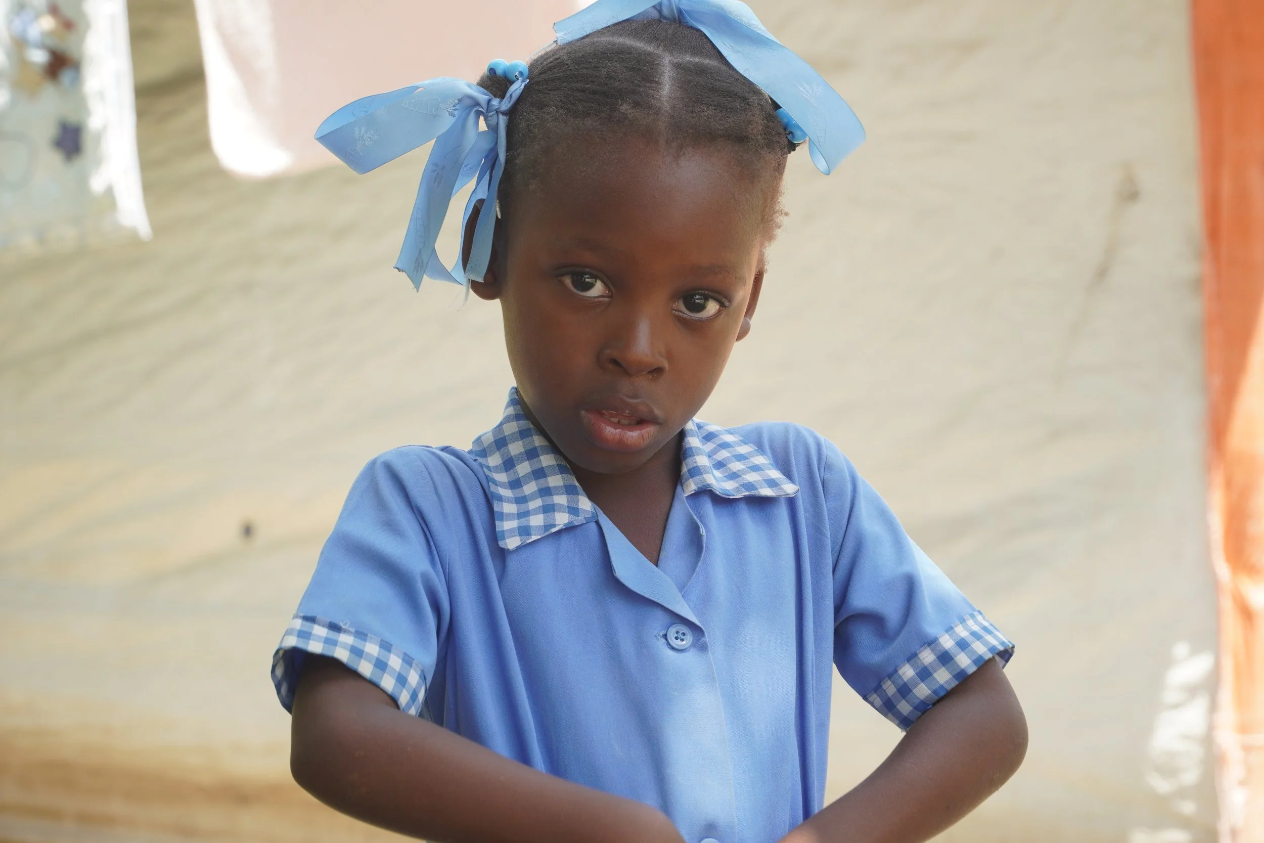 Little Haitian girl in her new school uniform