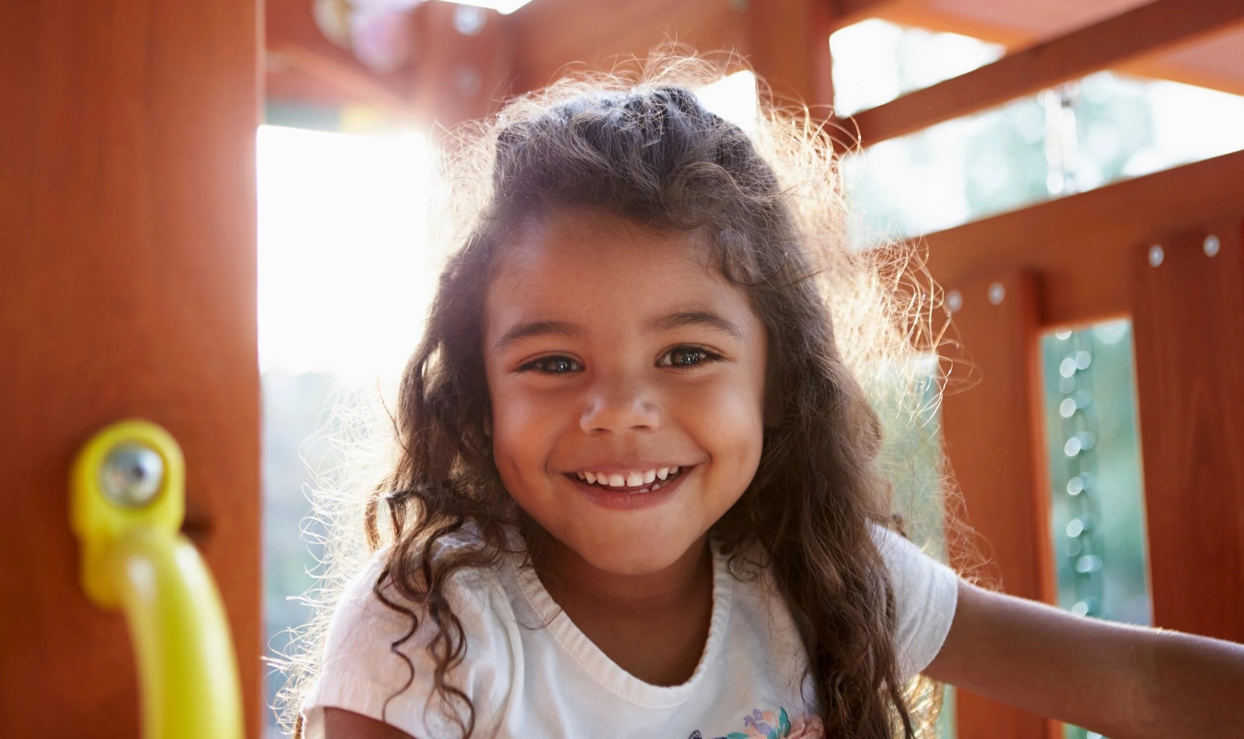 Little girl smiling on the playground