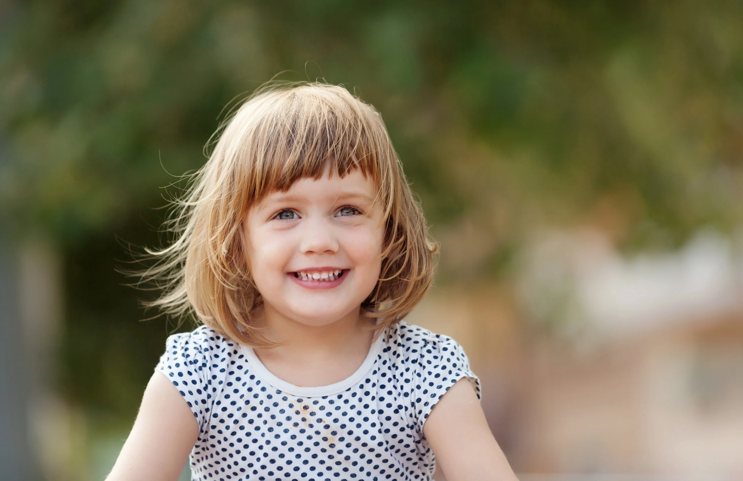 Little blond girl smiling