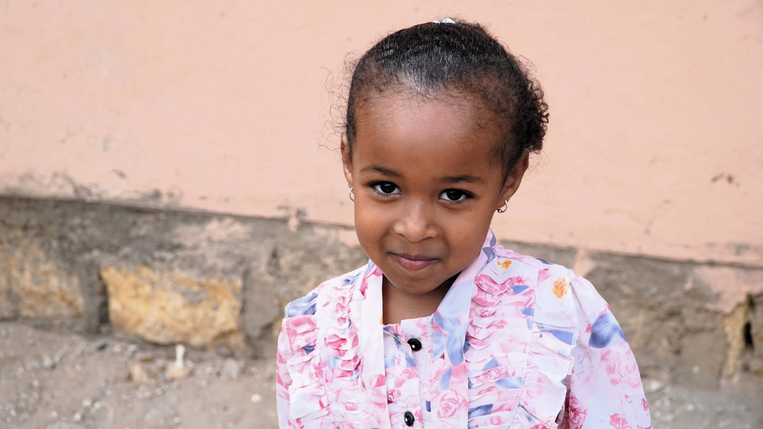 Little girl smiling shyly