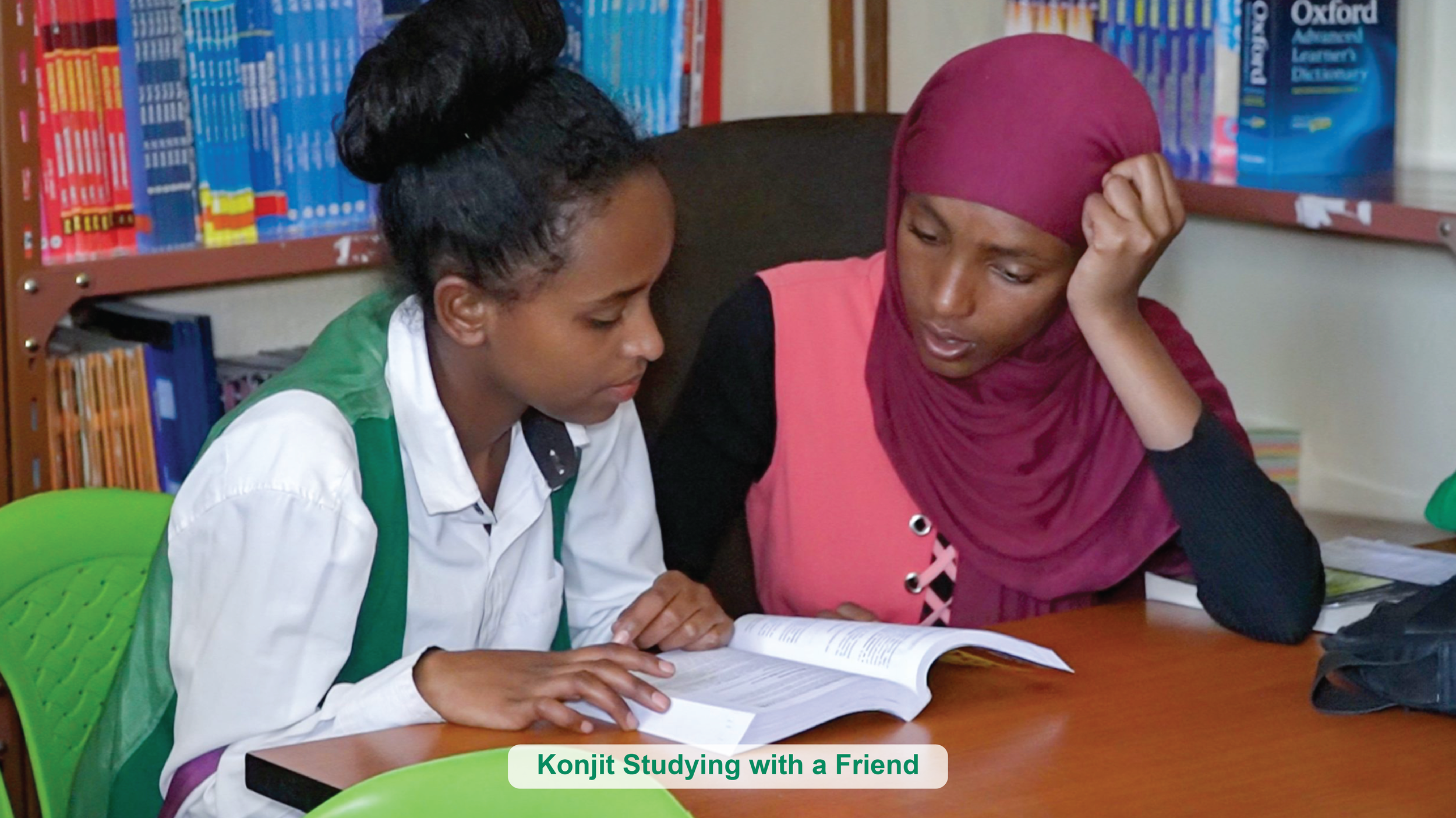 Konjit and her friend studying together in the program's library