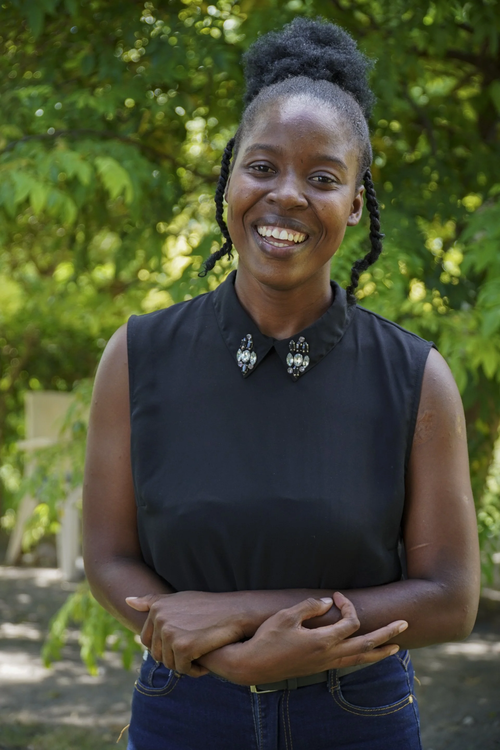 Young Haitian woman laughing outside