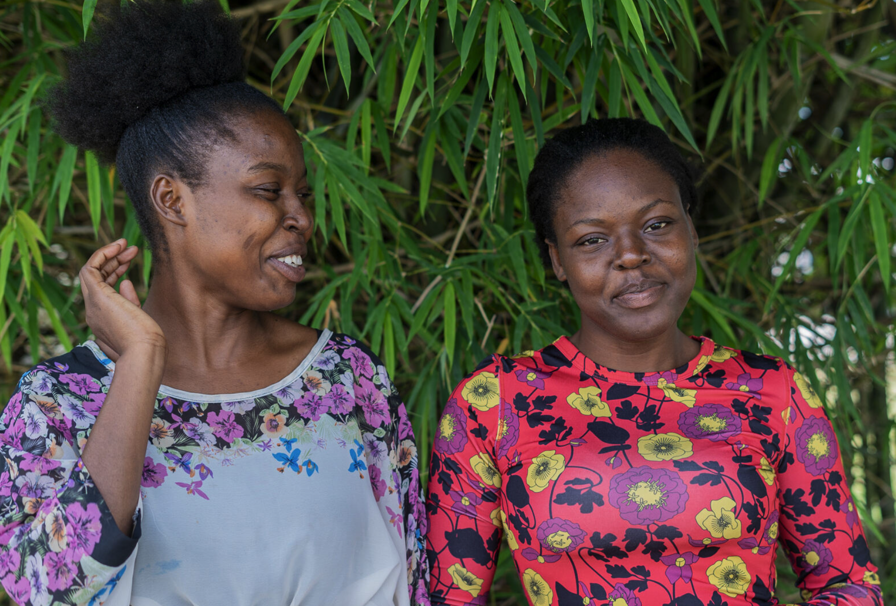 Two young women smiling together