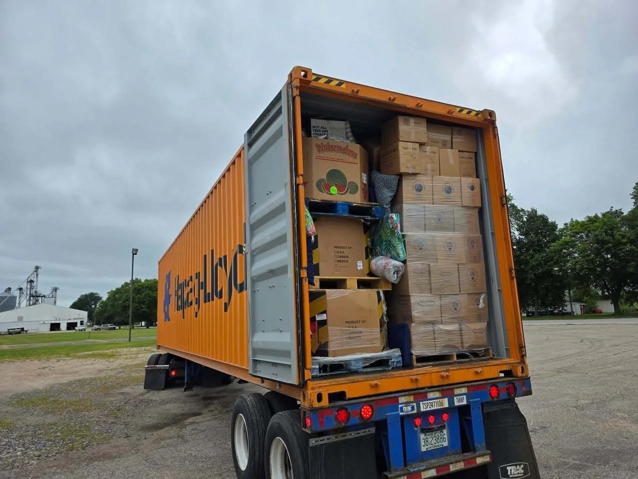 The open back of a semi truck shipping container full of boxes ready to be delivered to Ukraine